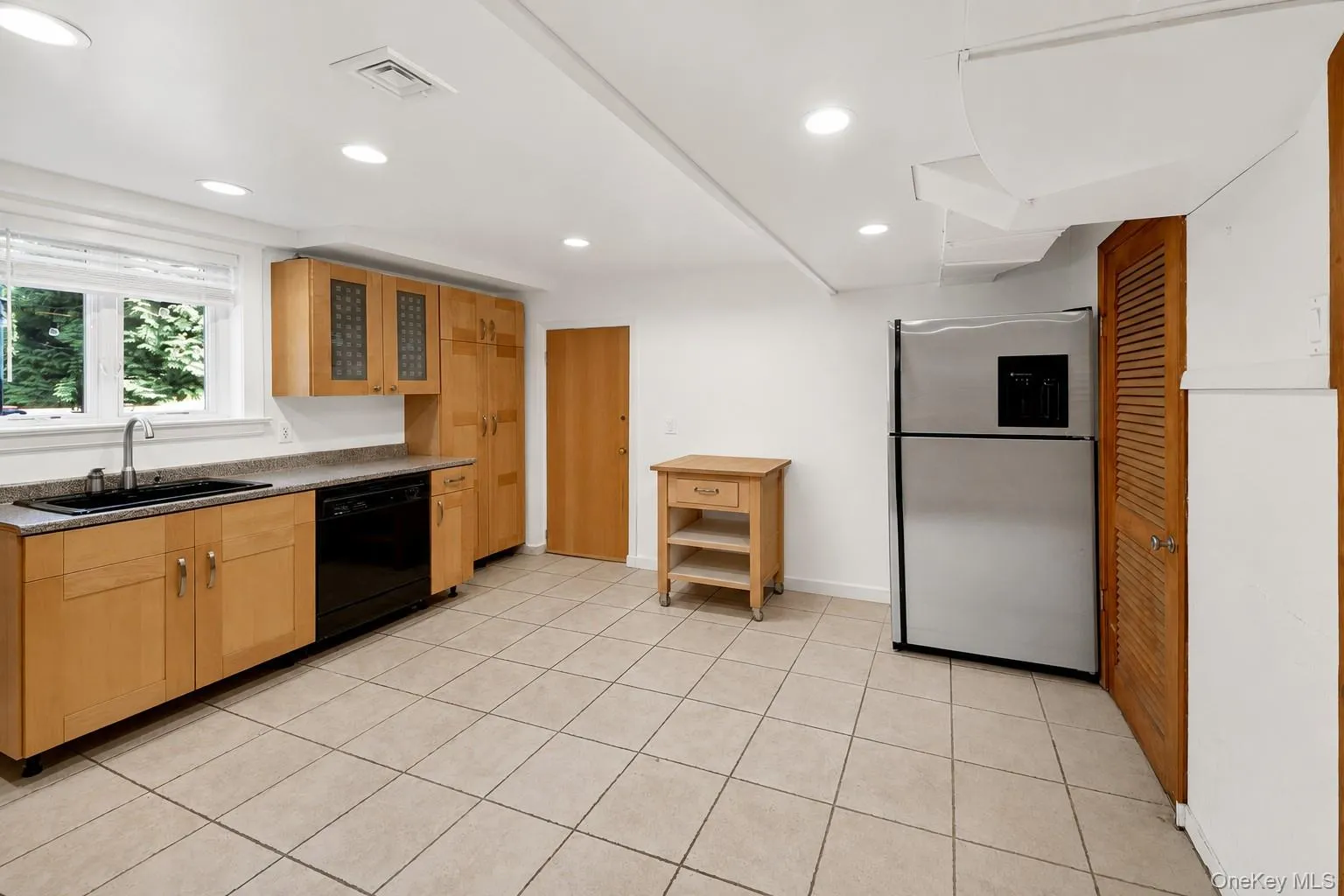 Finished Lower Level space equipped with bonus space, summer kitchen and full bathroom Finished Lower Level space equipped with bonus space, summer kitchen and full bathroom