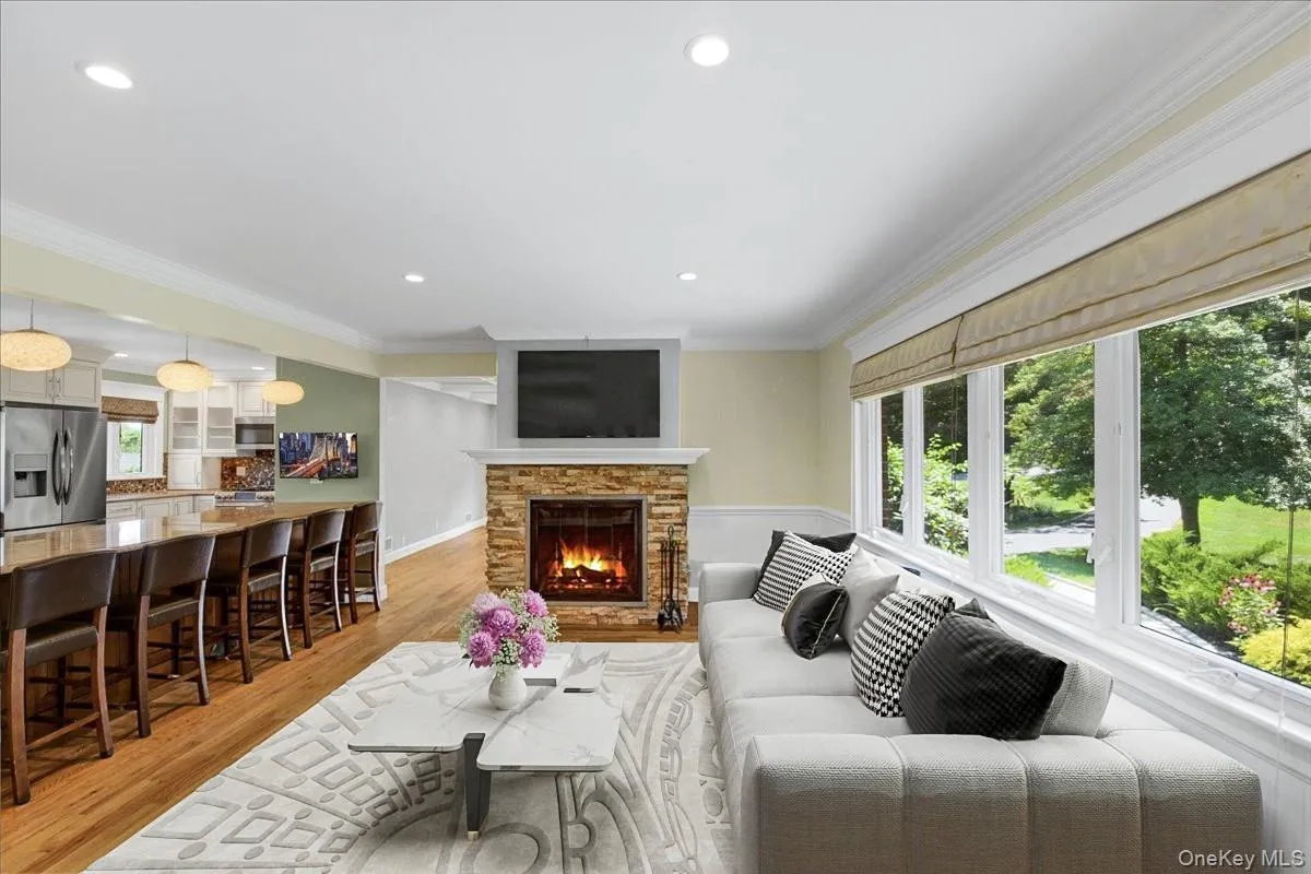 As you enter you are greeted into the living room overlooking open concept kitchen. Couch, table & area rug have been virtually staged. As you enter you are greeted into the living room overlooking open concept kitchen. Couch, table & area rug have been virtually staged.