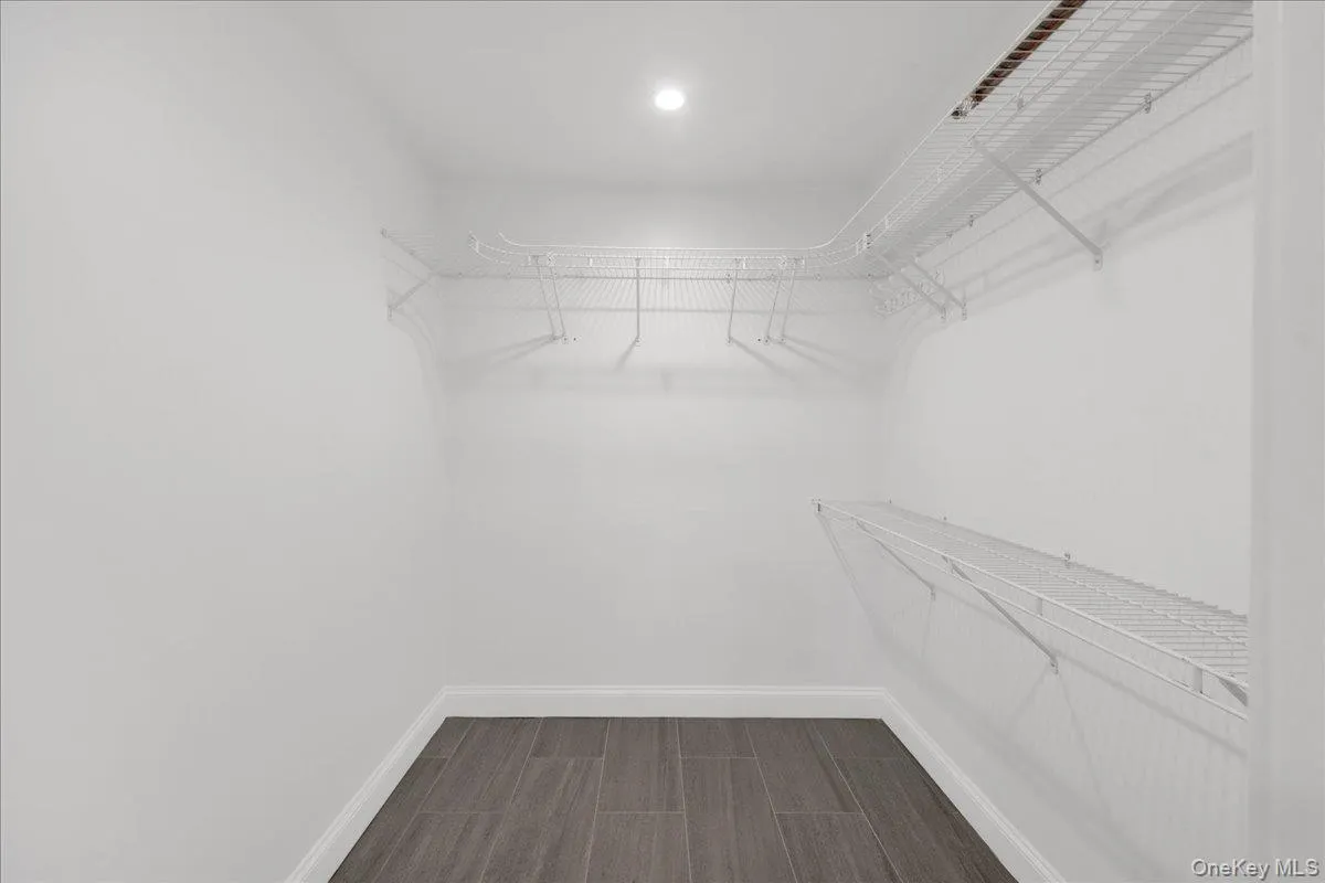 Primary Bedroom Walk-in closet Primary Bedroom Walk-in closet