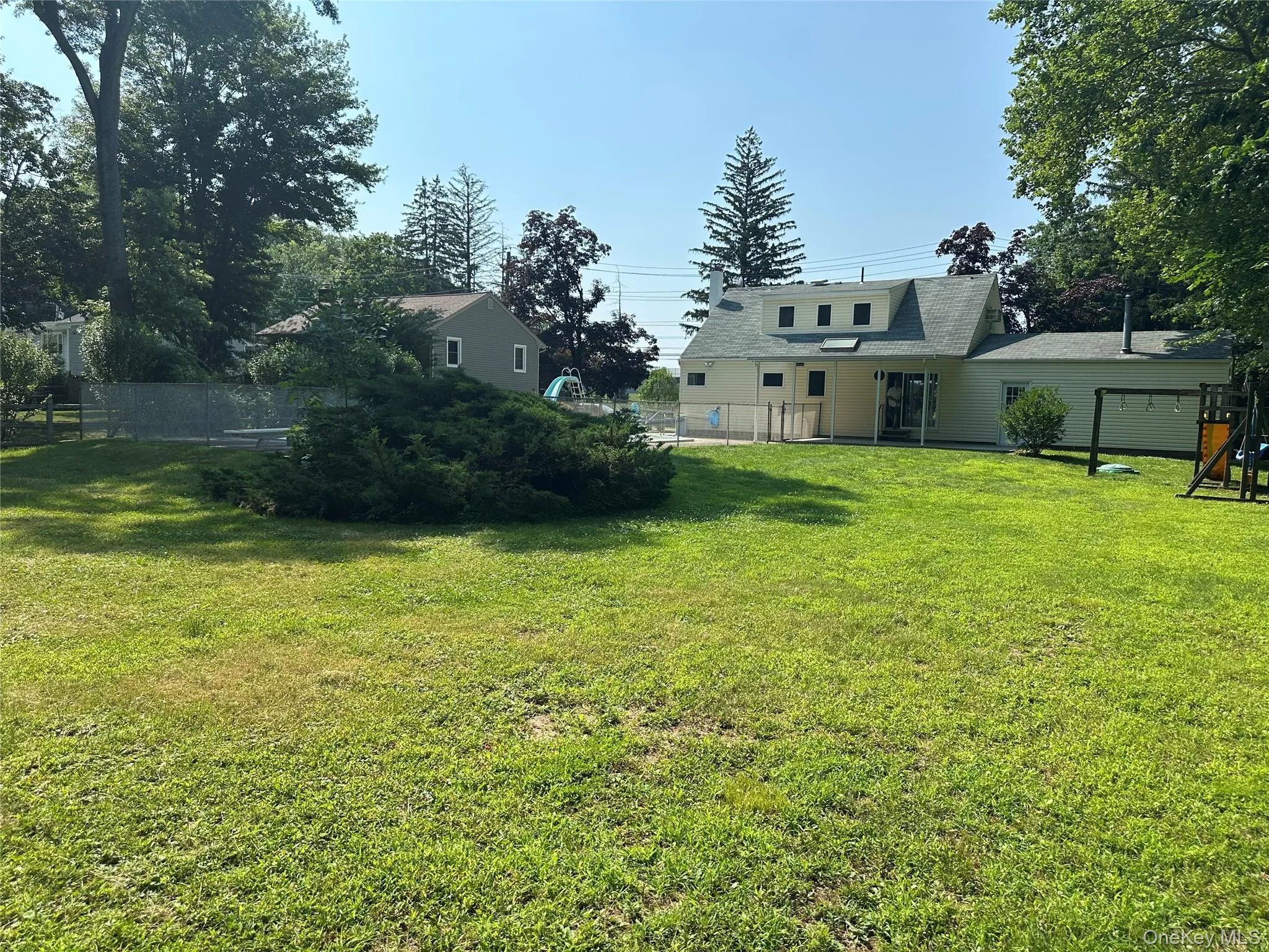Large level yard partially fenced Large level yard partially fenced