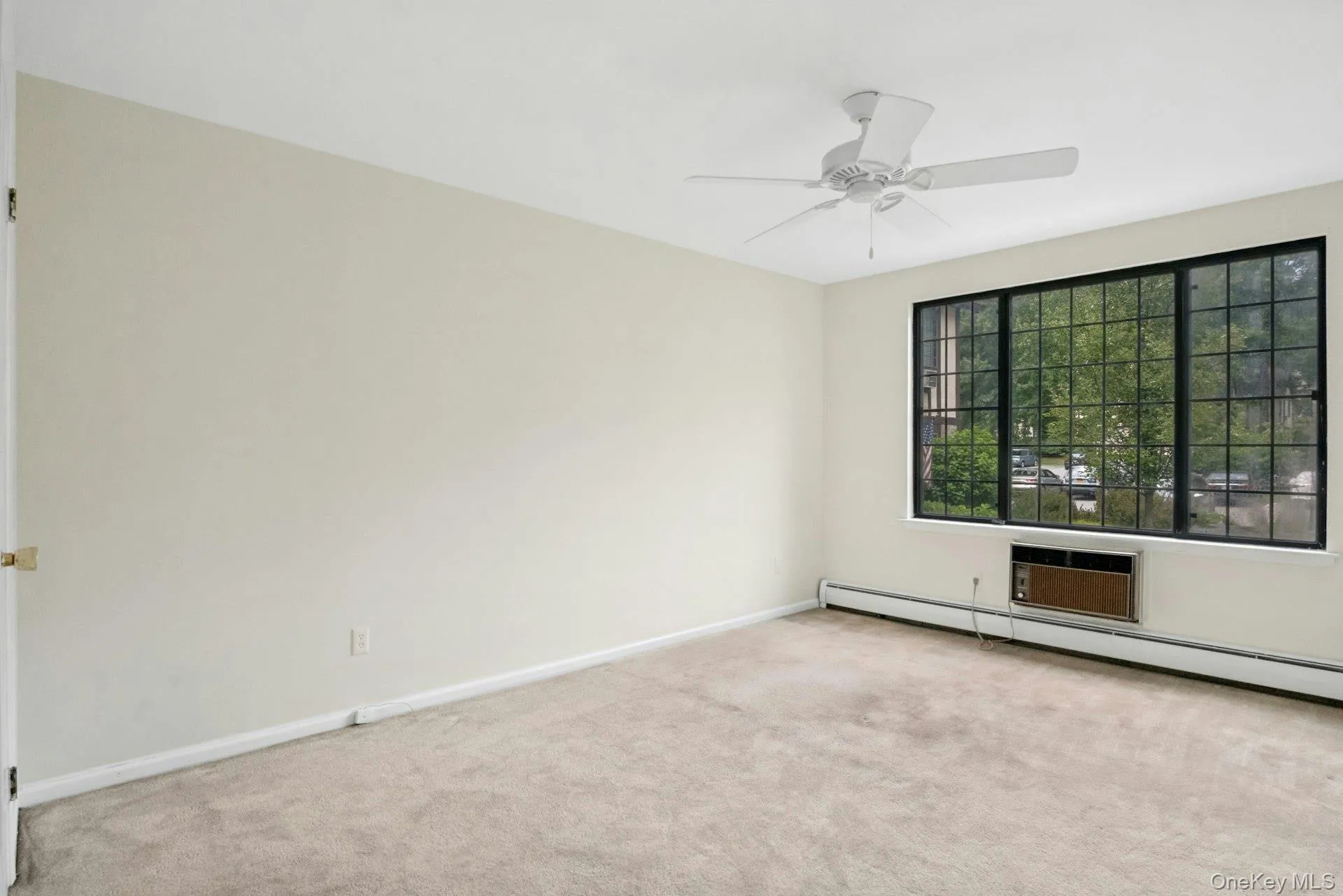 Bedroom with Picture Window, Ceiling Fan and Walk in Closet. Bedroom with Picture Window, Ceiling Fan and Walk in Closet.