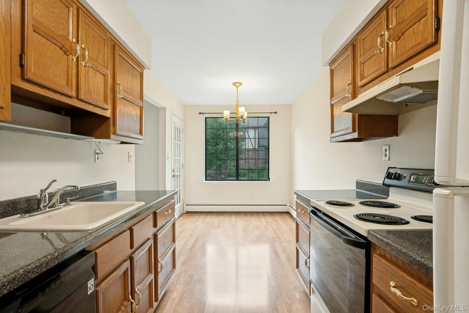 Galley Kitchen with Plenty of Cabinets and Counter Space .. Dining Area with a Door Out to the Deck. Galley Kitchen with Plenty of Cabinets and Counter Space .. Dining Area with a Door Out to the Deck.