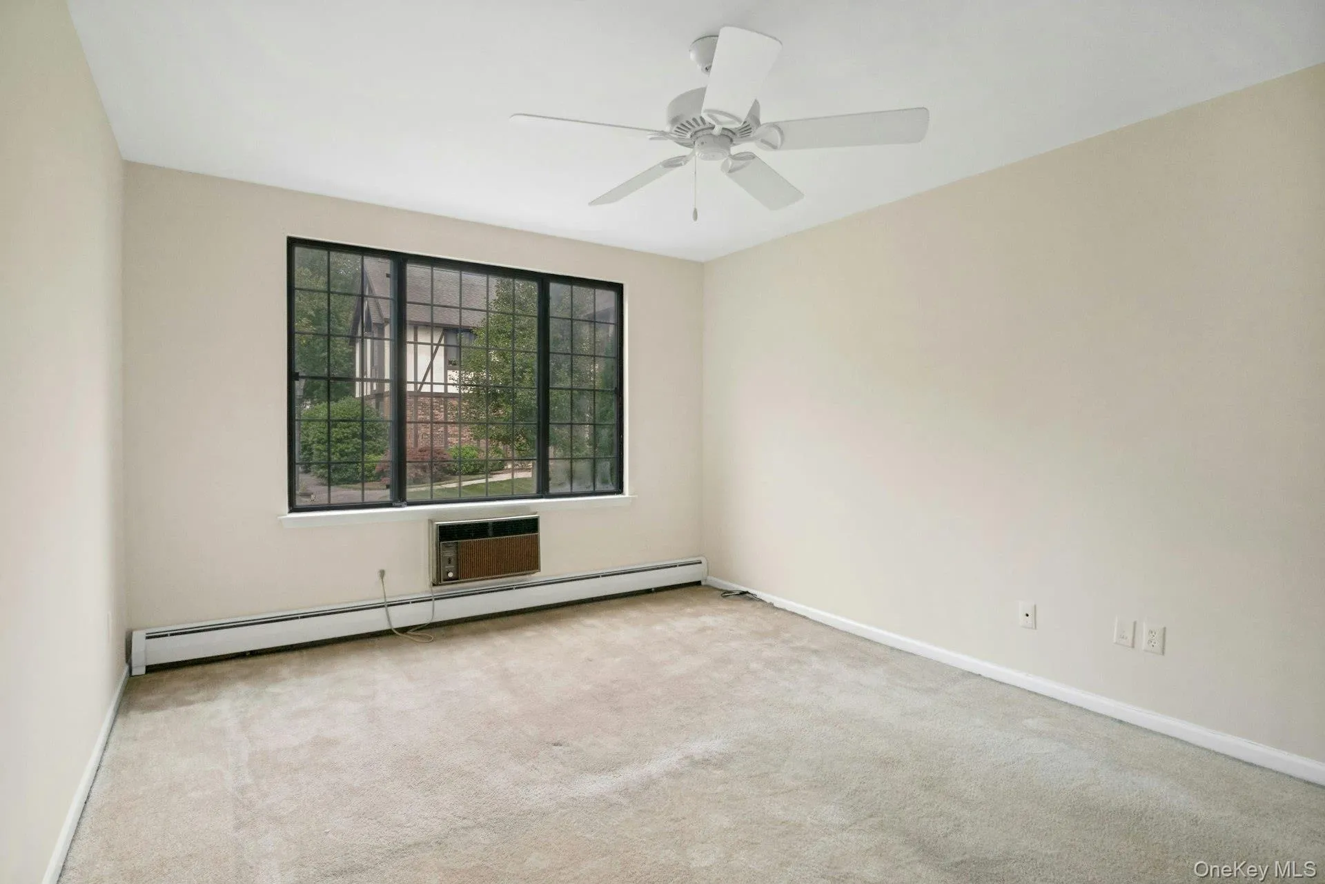 Bedroom with Picture Window, Ceiling Fan and Walk in Closet. Bedroom with Picture Window, Ceiling Fan and Walk in Closet.