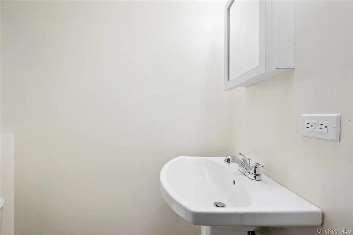 Lower level half bath. Lower level half bath.