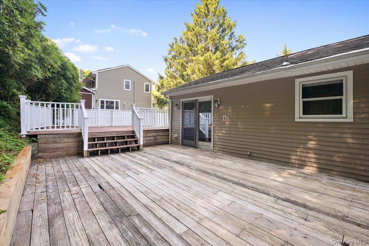Multi-tier rear deck - slider to the dining area. Multi-tier rear deck - slider to the dining area.