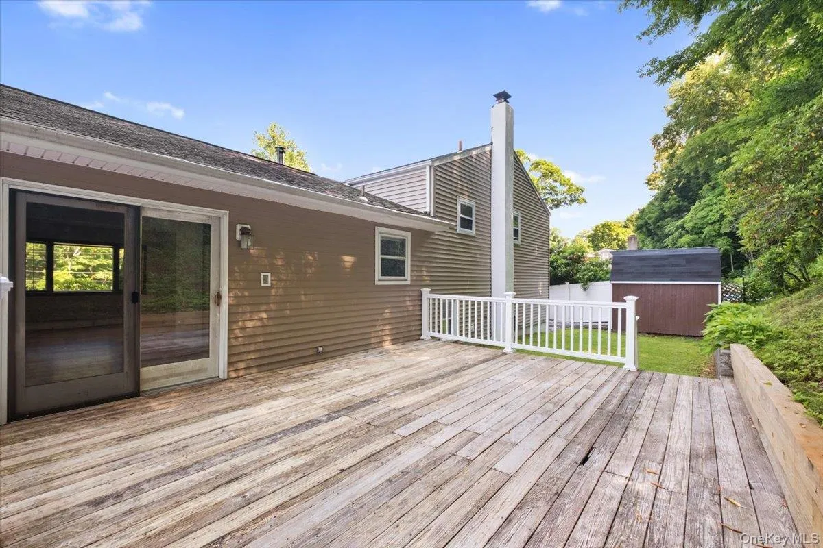 Slider to the dining room, deck and back yard access. Slider to the dining room, deck and back yard access.