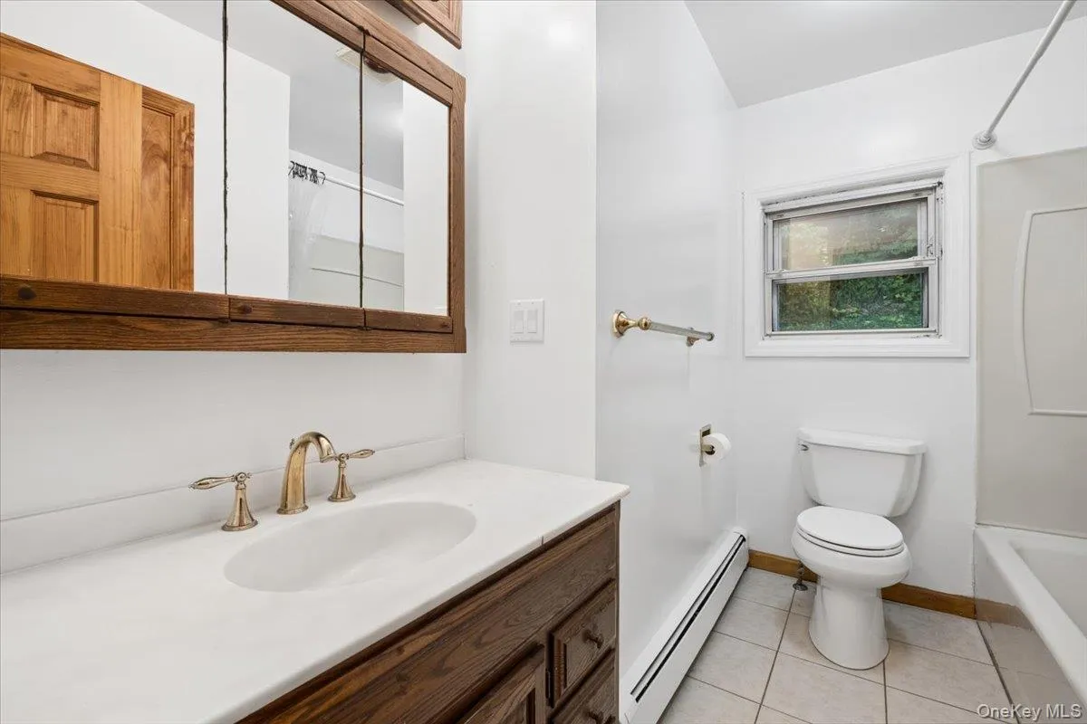 At the top of the stairs is a large hall bath with tub/shower combo, comfortable vanity and a linen closet. At the top of the stairs is a large hall bath with tub/shower combo, comfortable vanity and a linen closet.