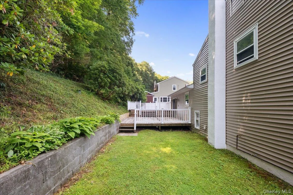 Level back yard, looking toward the deck. Level back yard, looking toward the deck.
