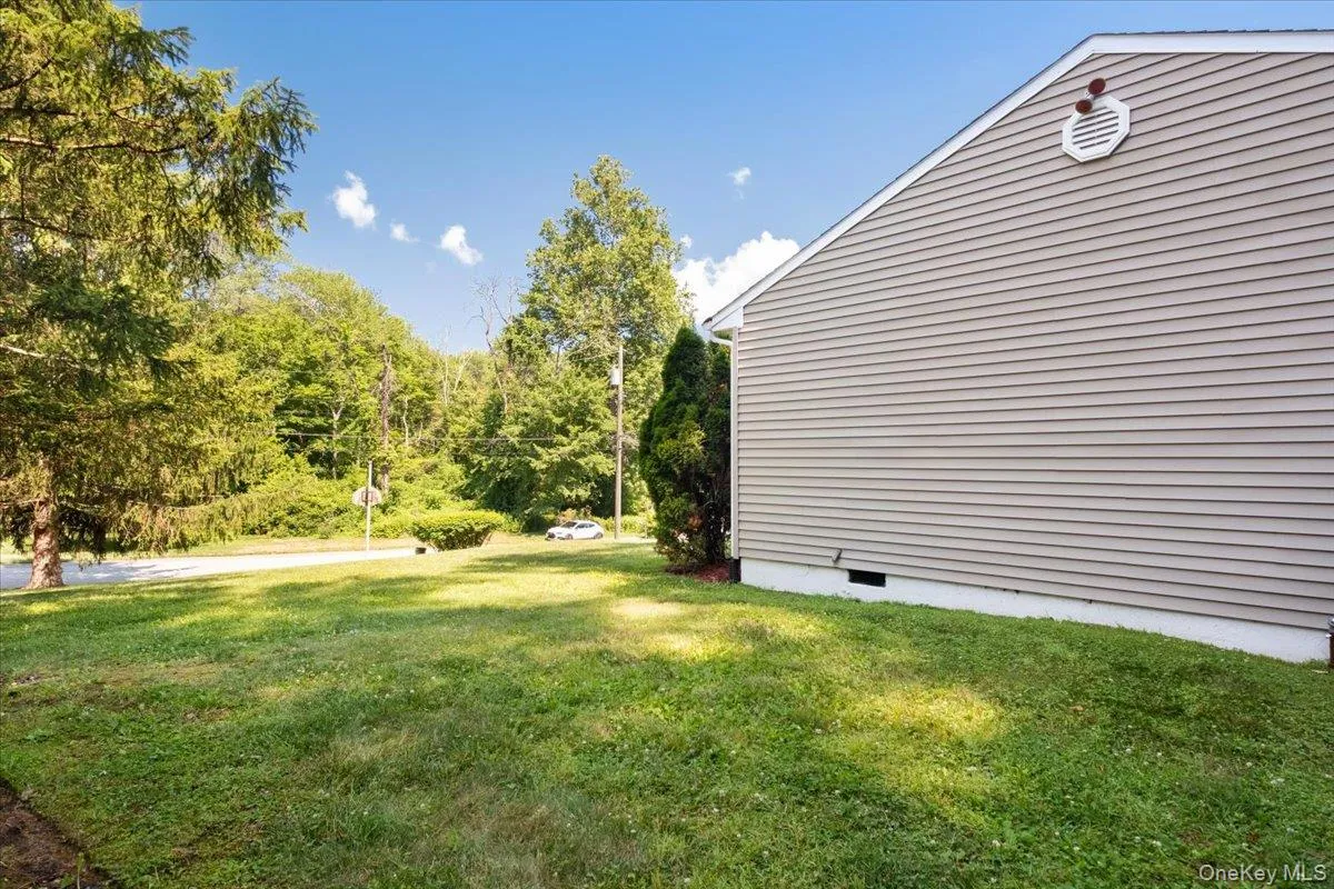 Right side yard, looking to the street. Right side yard, looking to the street.