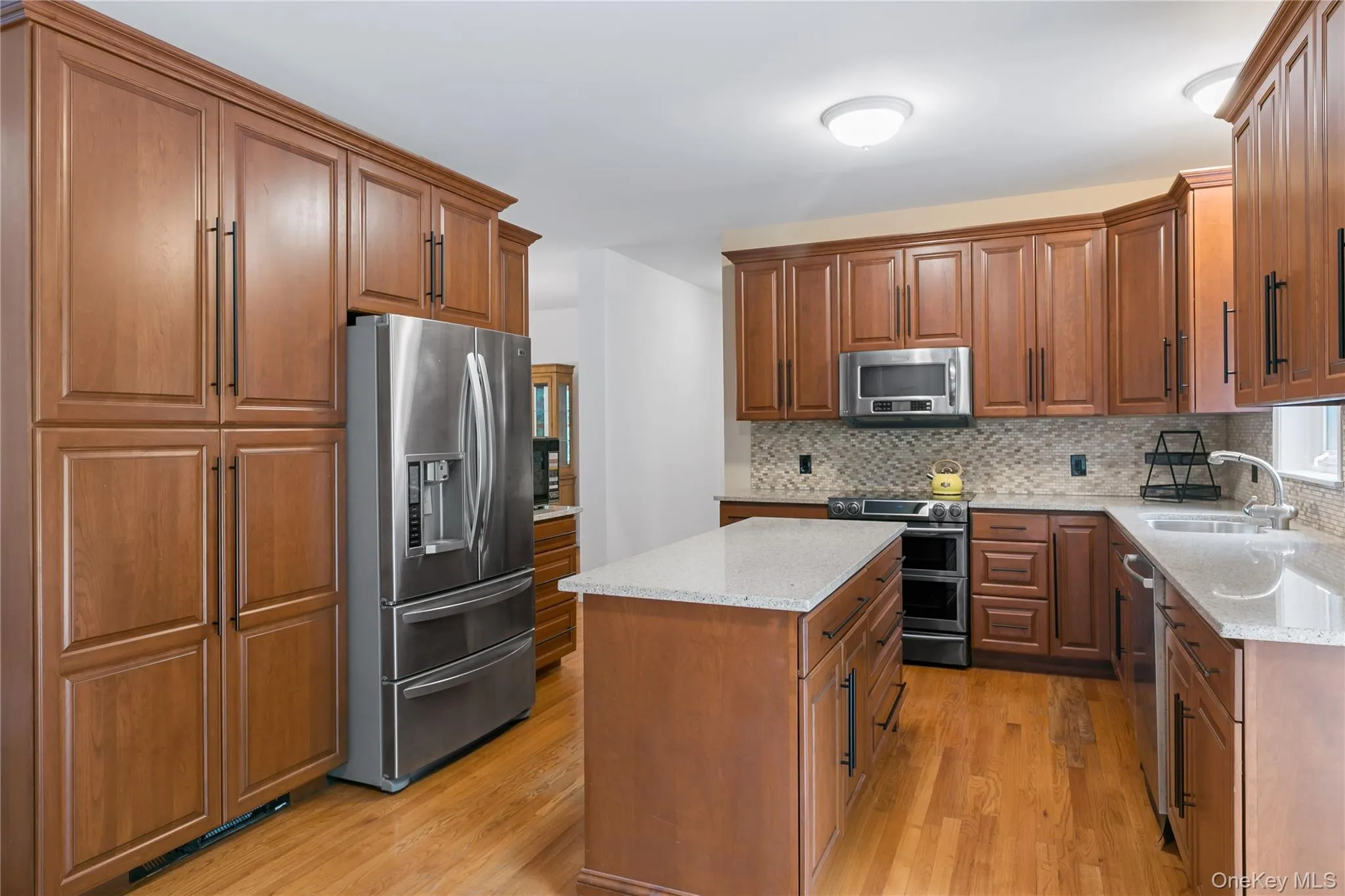 Lots of cabinets and center island Lots of cabinets and center island