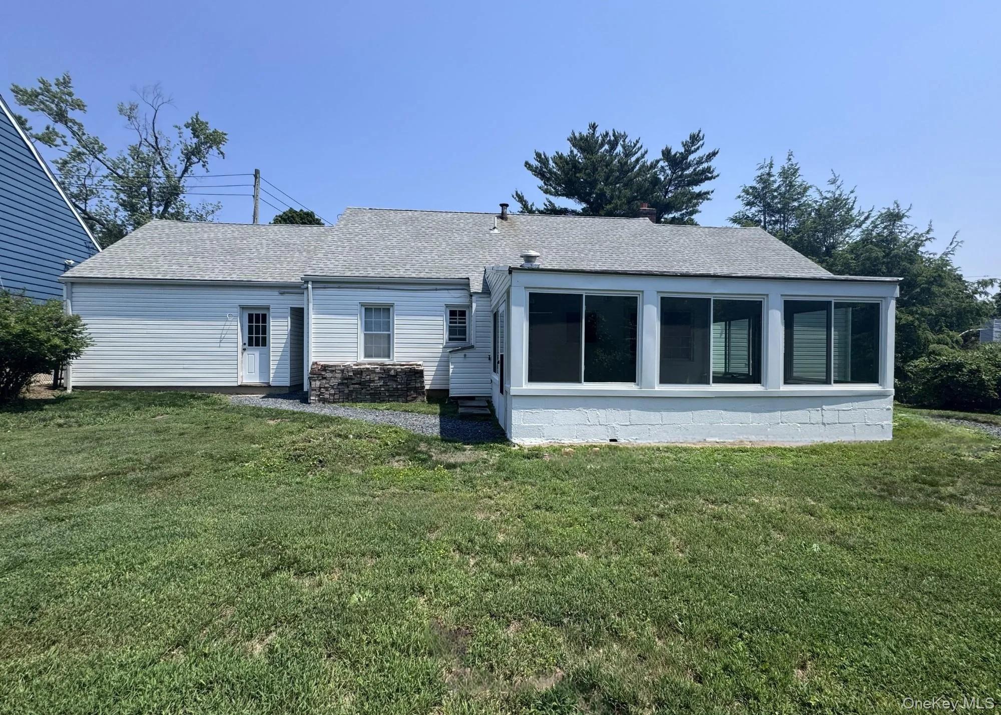 Backyard with ample space for lounging or entertaining. Backyard with ample space for lounging or entertaining.