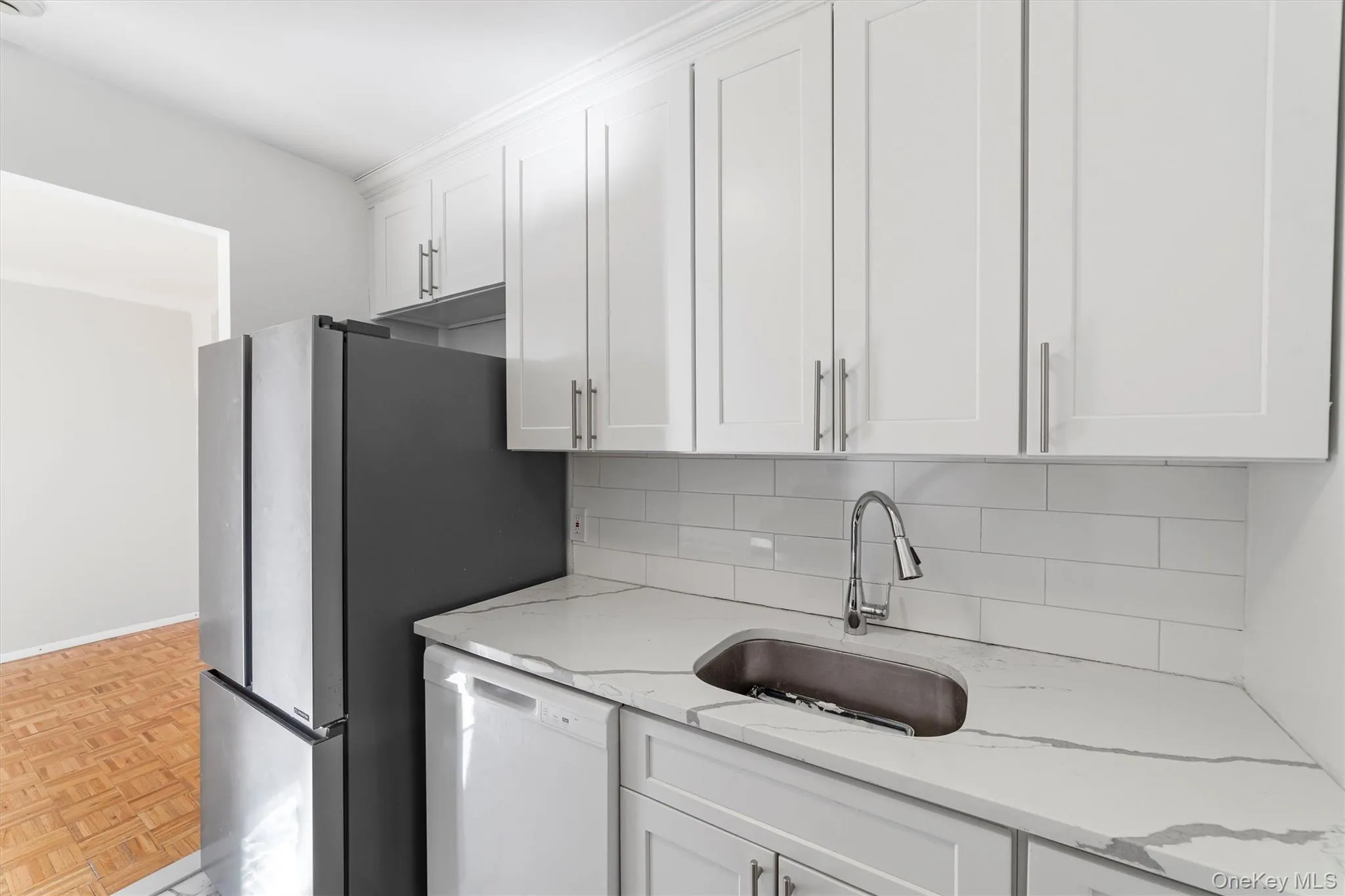 The kitchen opens to the dining area. The kitchen opens to the dining area.