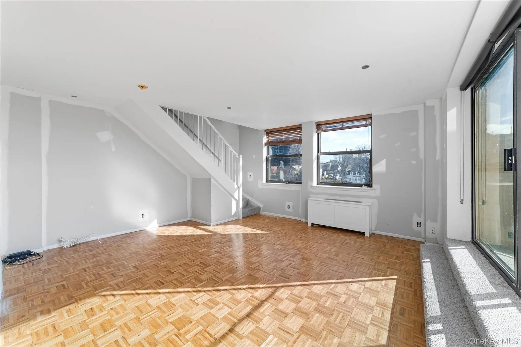 Enter into the spacious, sun filled living room and dining room. The entire unit is accented with parquet flooring. Enter into the spacious, sun filled living room and dining room. The entire unit is accented with parquet flooring.