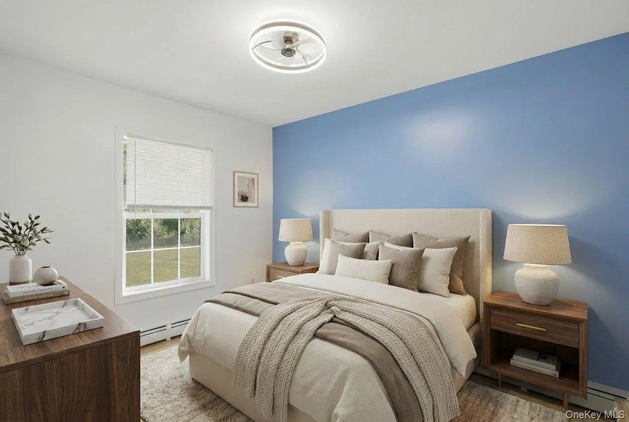 This downstairs bedroom has been virtually staged. This downstairs bedroom has been virtually staged.