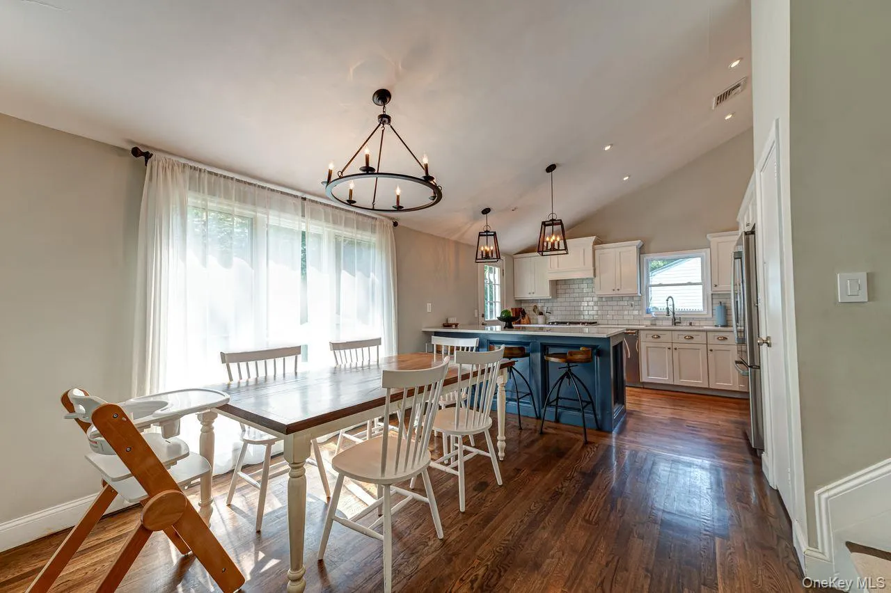 Dining area with large floor to ceiling window Dining area with large floor to ceiling window