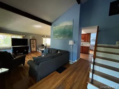 Living room hallway and staircase to upstairs bedroom. Living room hallway and staircase to upstairs bedroom.