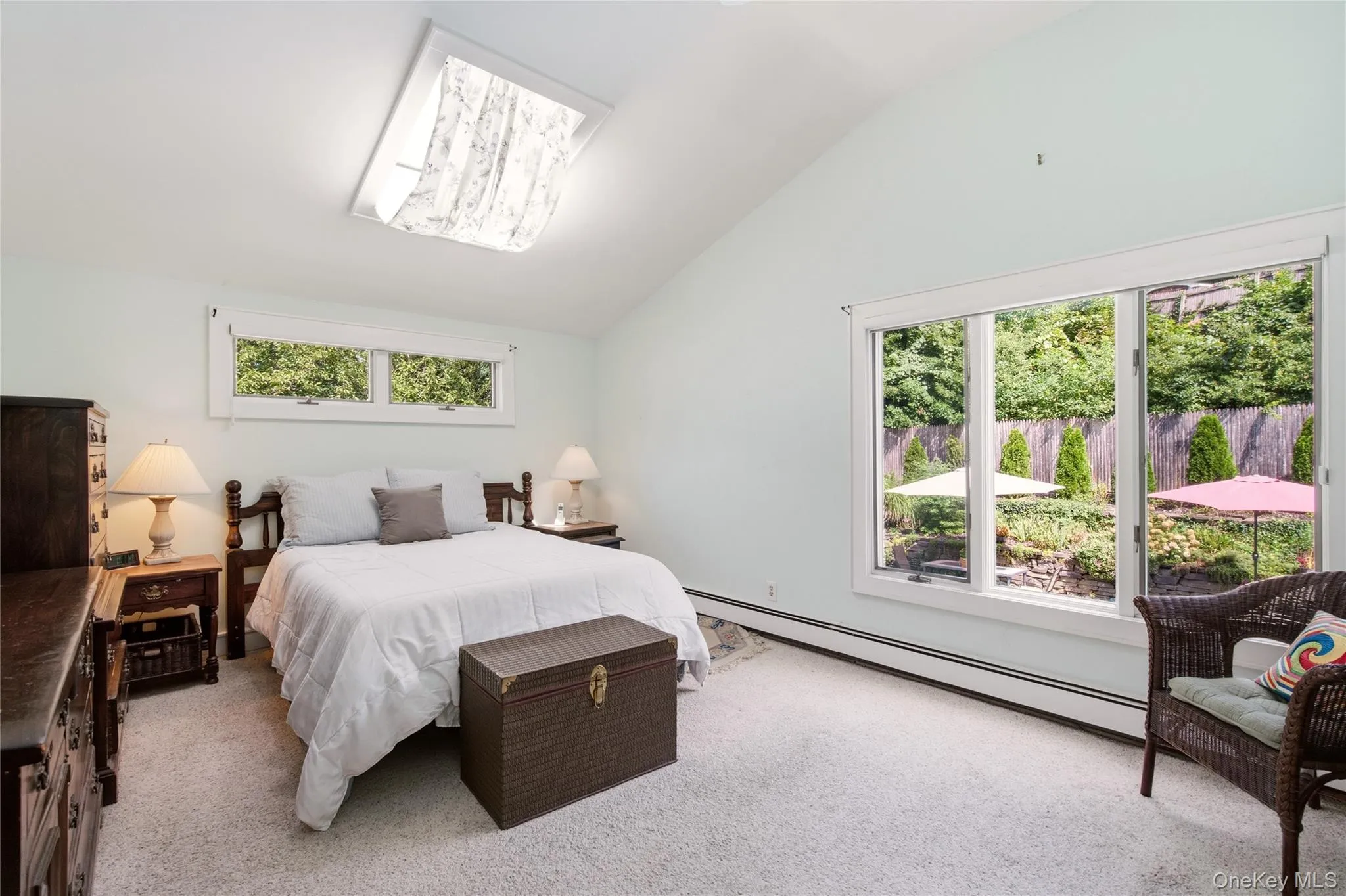 Primary bedroom with picturesque pool views Primary bedroom with picturesque pool views