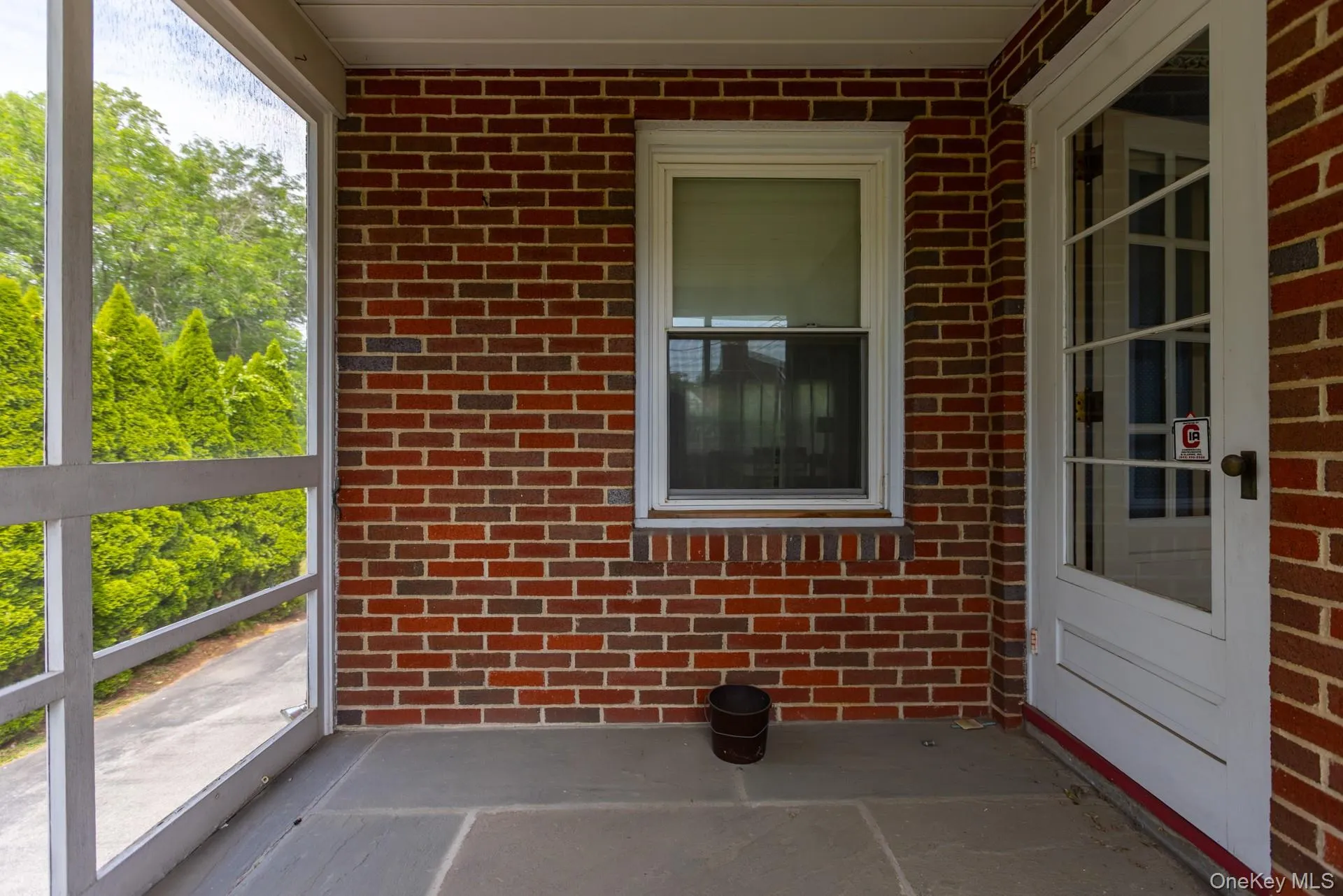 Screened in porch off of kitchen Screened in porch off of kitchen