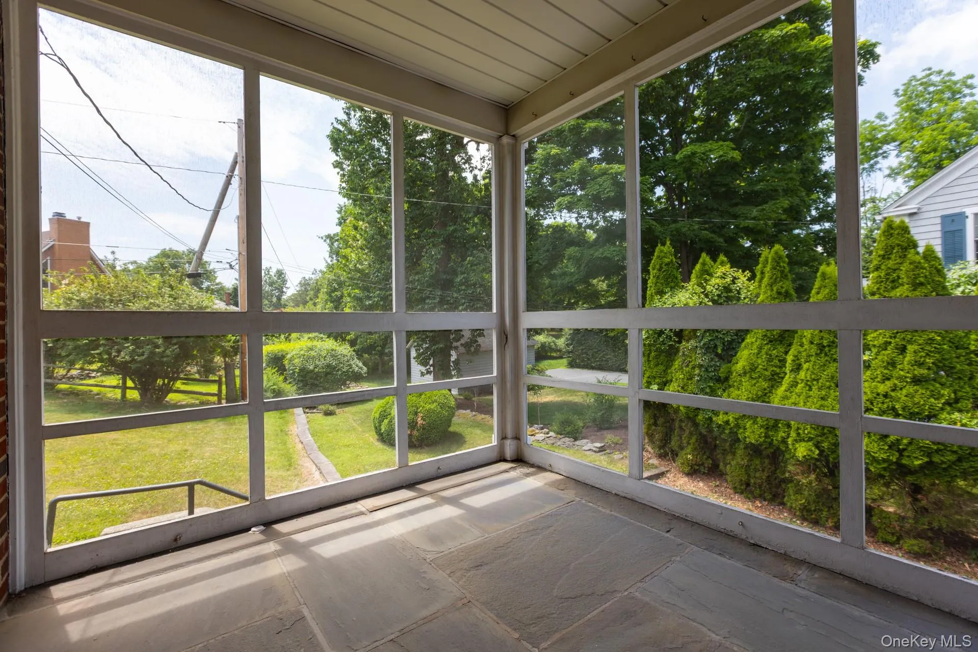 Screened in porch off of kitchen Screened in porch off of kitchen