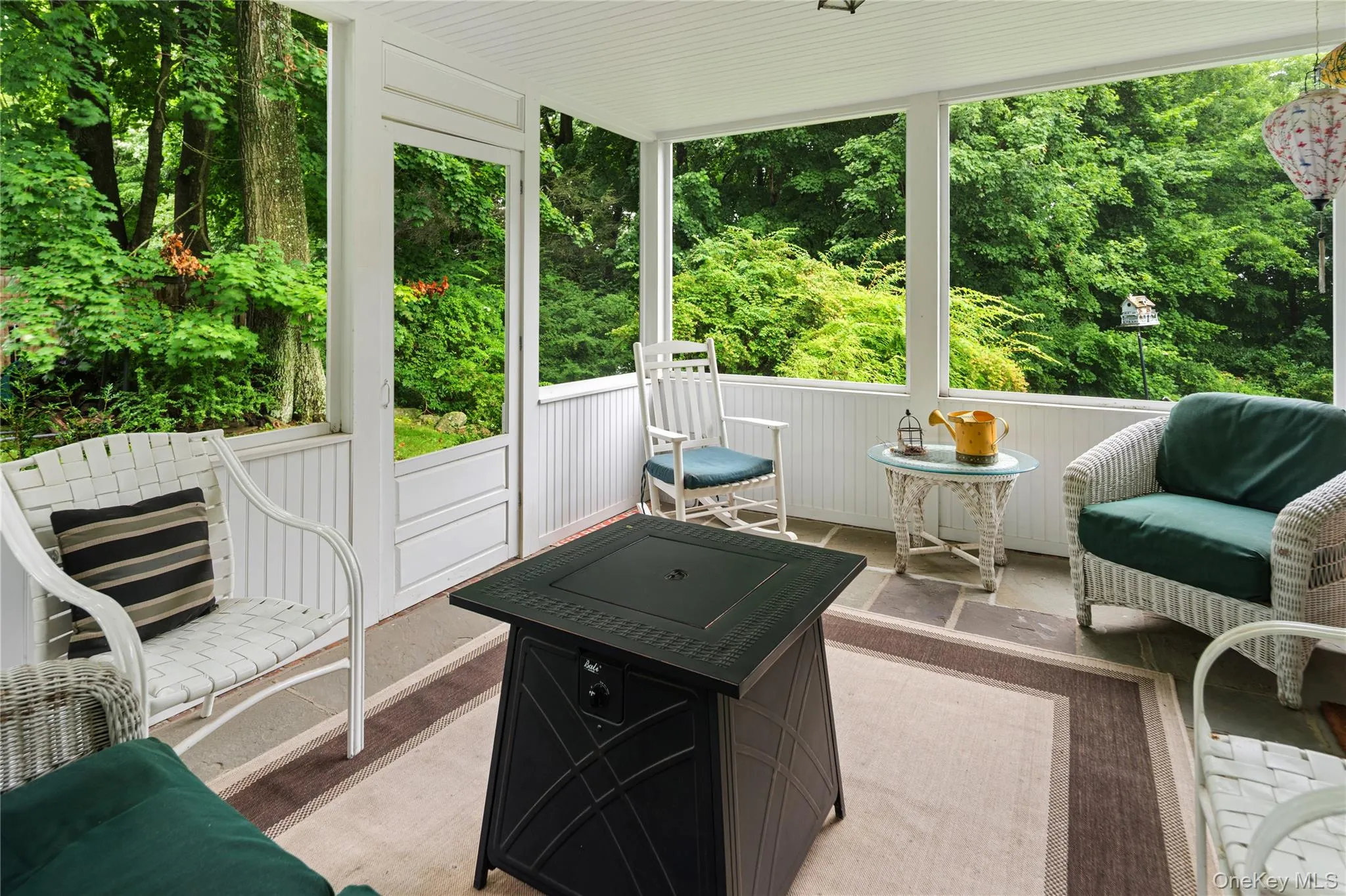 Screened porch accessed by French door off of formal living room, door to yard Screened porch accessed by French door off of formal living room, door to yard