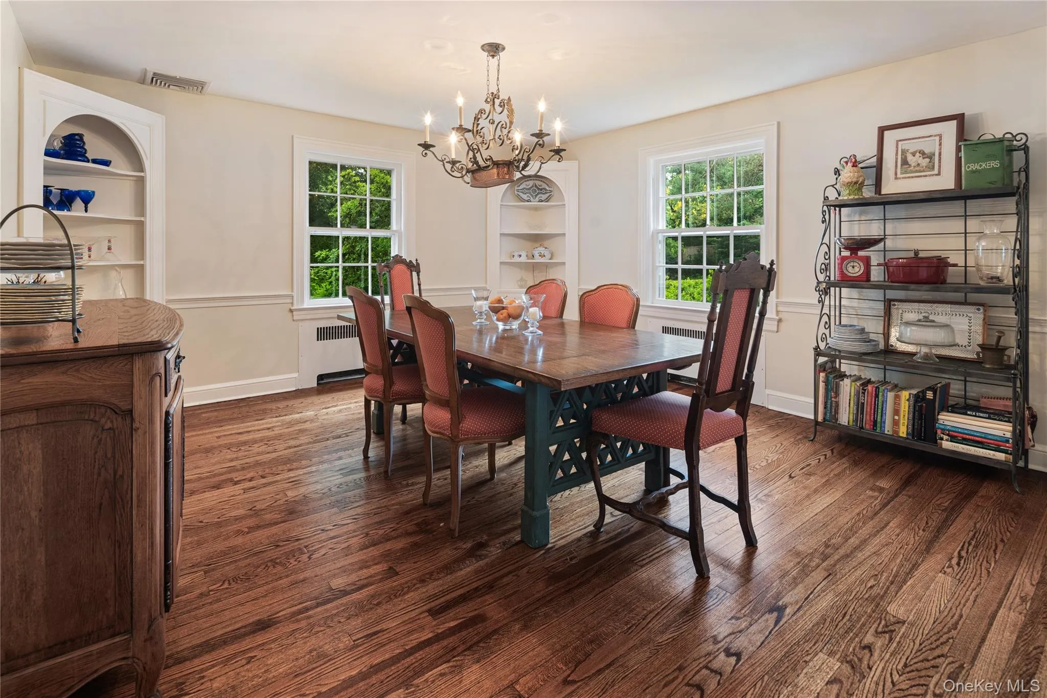 Formal dining room with built-in corner cupboards, oak floors, new windows, crown molding, chair rail Formal dining room with built-in corner cupboards, oak floors, new windows, crown molding, chair rail