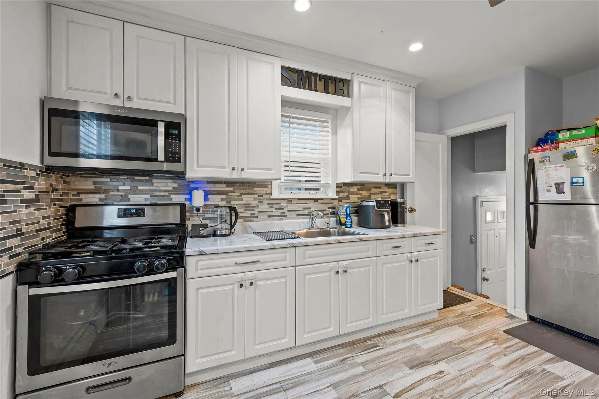 Renovated kitchen from another angle. Renovated kitchen from another angle.