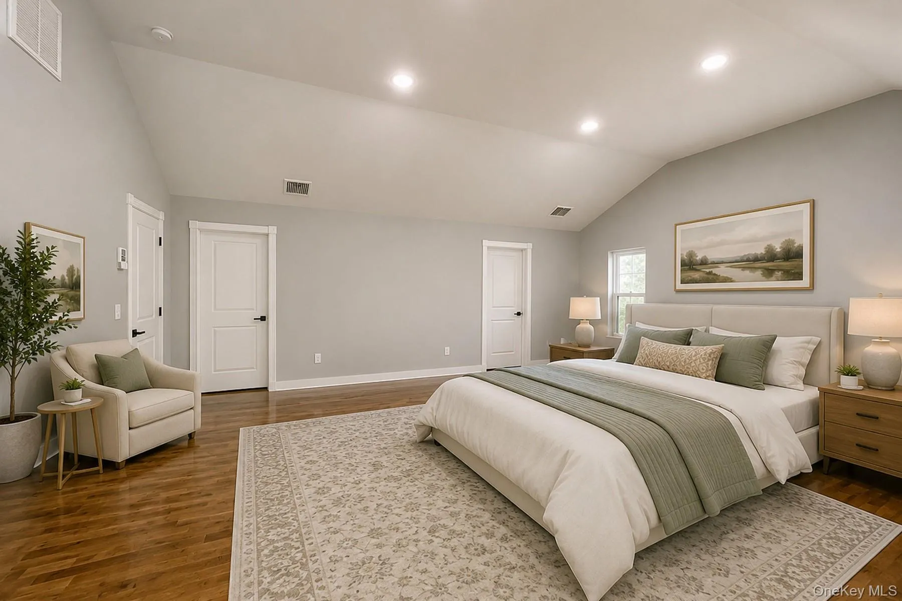 Virtually staged, primary bedroom featuring hardwood floors, ductless a/c, vaulted ceiling, oversized windows for peaceful, natural sunlight Virtually staged, primary bedroom featuring hardwood floors, ductless a/c, vaulted ceiling, oversized windows for peaceful, natural sunlight