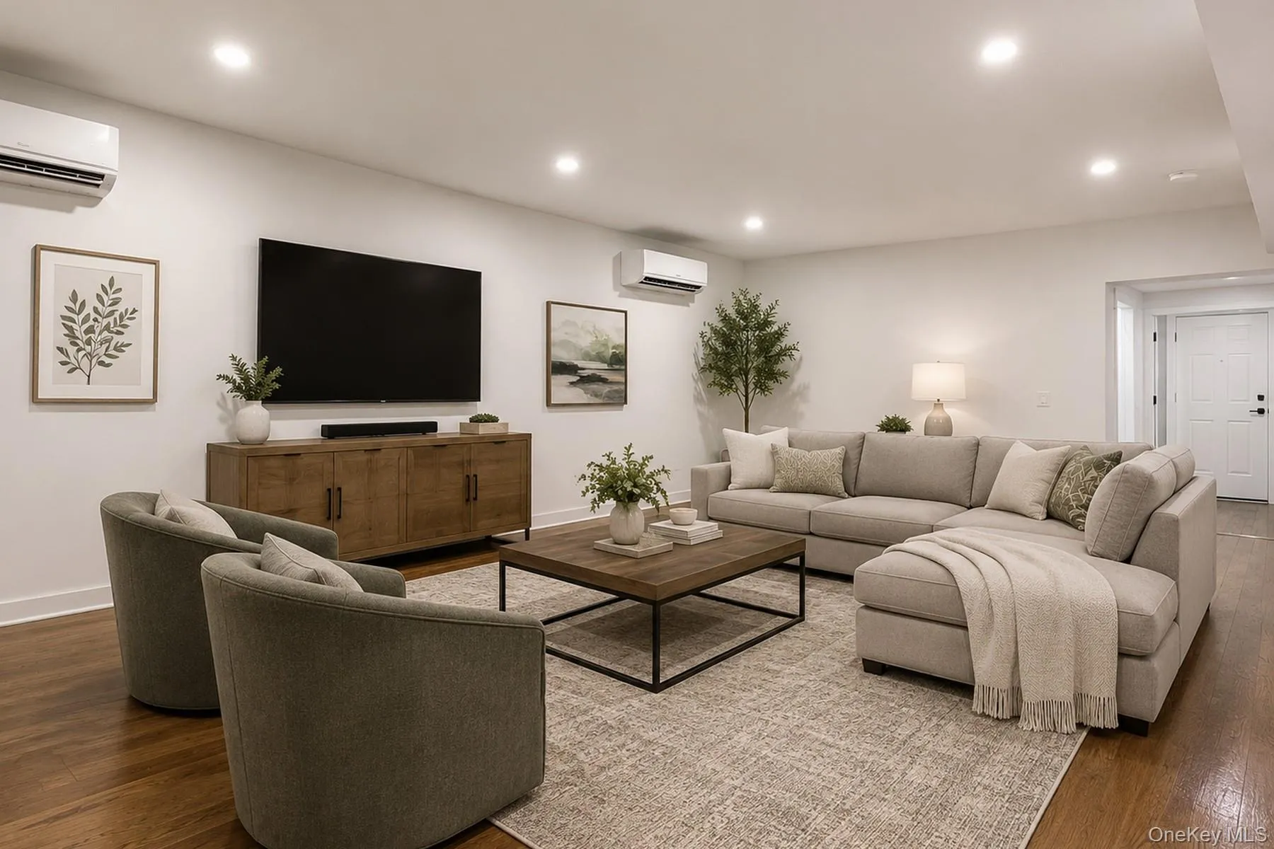 Family Room, or have the dining room here, just off the kitchen, spacious interior featuring hardwood flooring, recessed lighting, and ductless air conditioning units Family Room, or have the dining room here, just off the kitchen, spacious interior featuring hardwood flooring, recessed lighting, and ductless air conditioning units