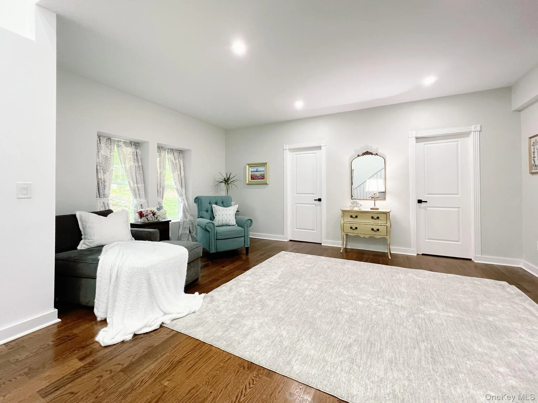 Spacious room for dining, or added living space, featuring rich hardwood flooring, recessed lighting, and two expansive walk-in closets Spacious room for dining, or added living space, featuring rich hardwood flooring, recessed lighting, and two expansive walk-in closets