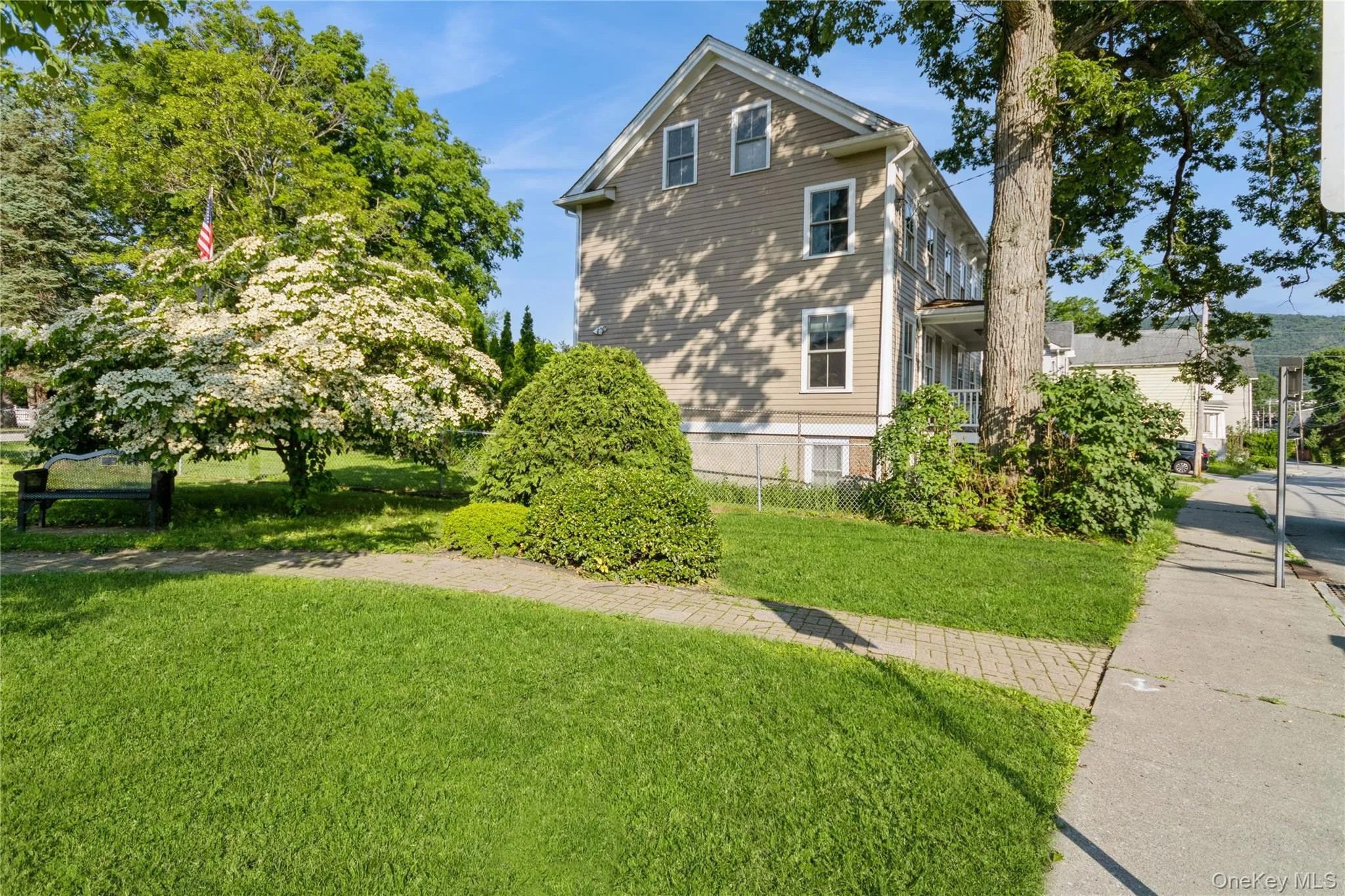 View of property exterior featuring a lawn View of property exterior featuring a lawn
