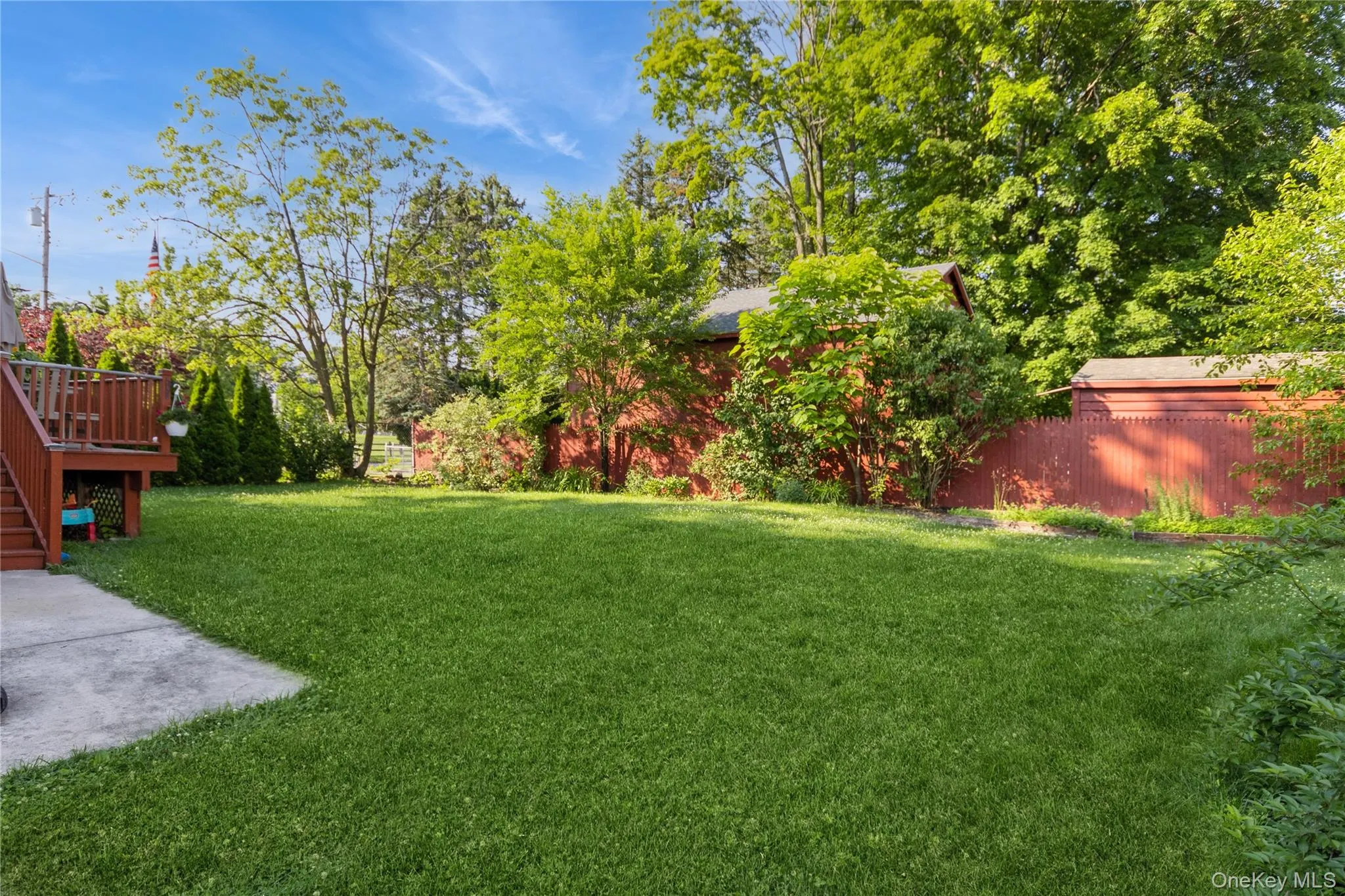 View of yard featuring stairway and a deck View of yard featuring stairway and a deck