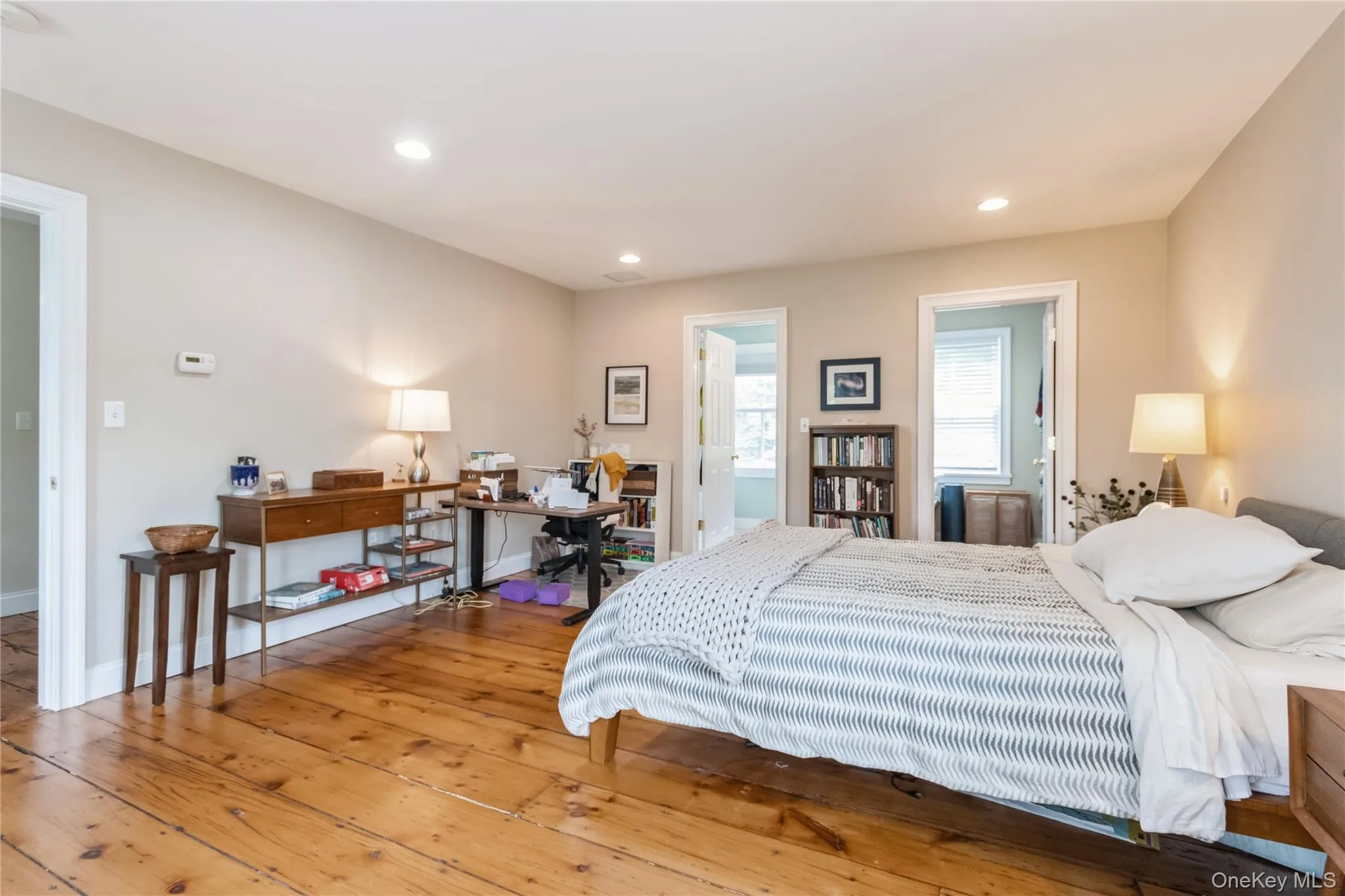 Bedroom featuring wood-type flooring, recessed lighting, and a desk Bedroom featuring wood-type flooring, recessed lighting, and a desk