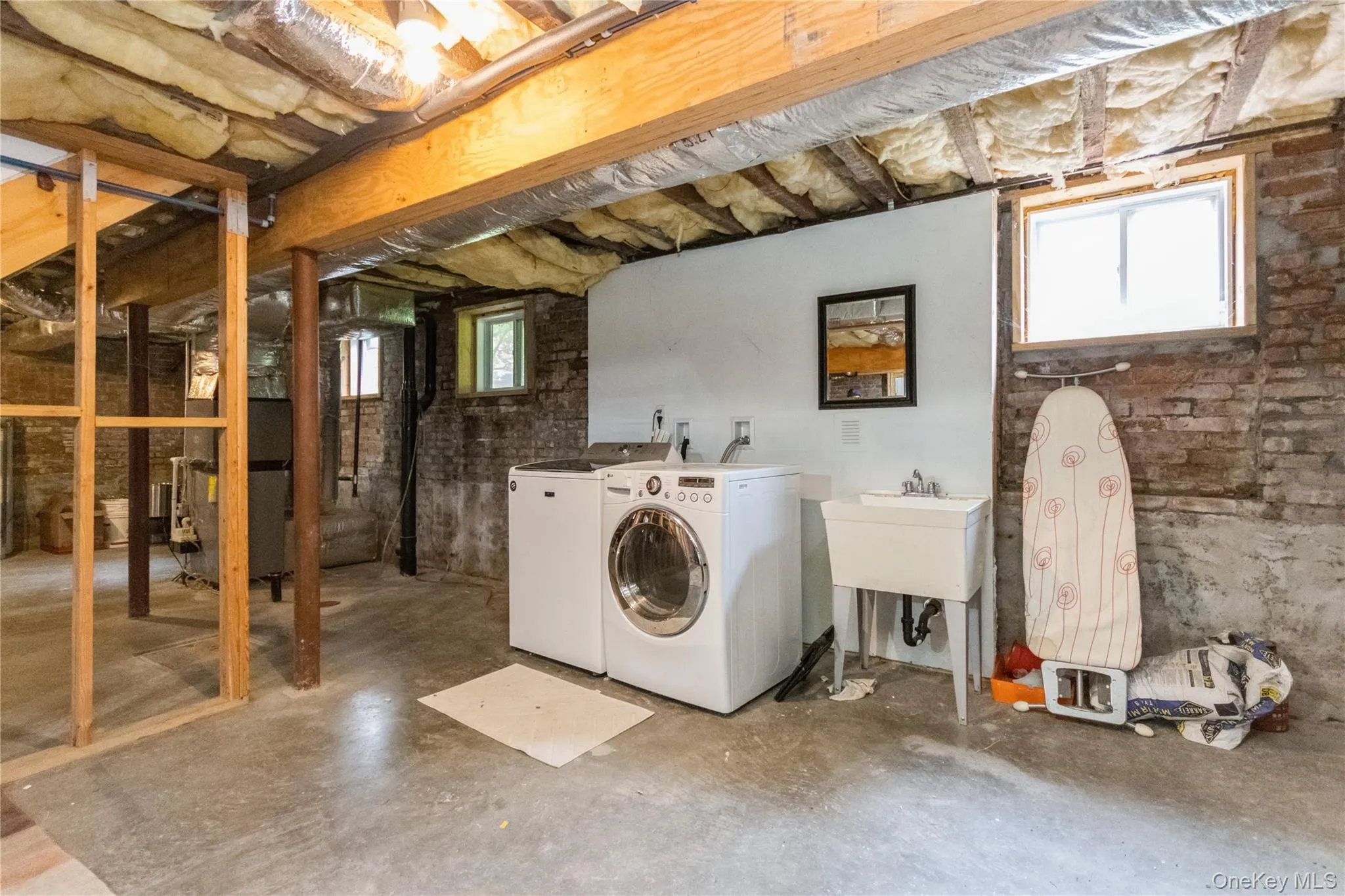 Washroom with washer and dryer and heating unit Washroom with washer and dryer and heating unit