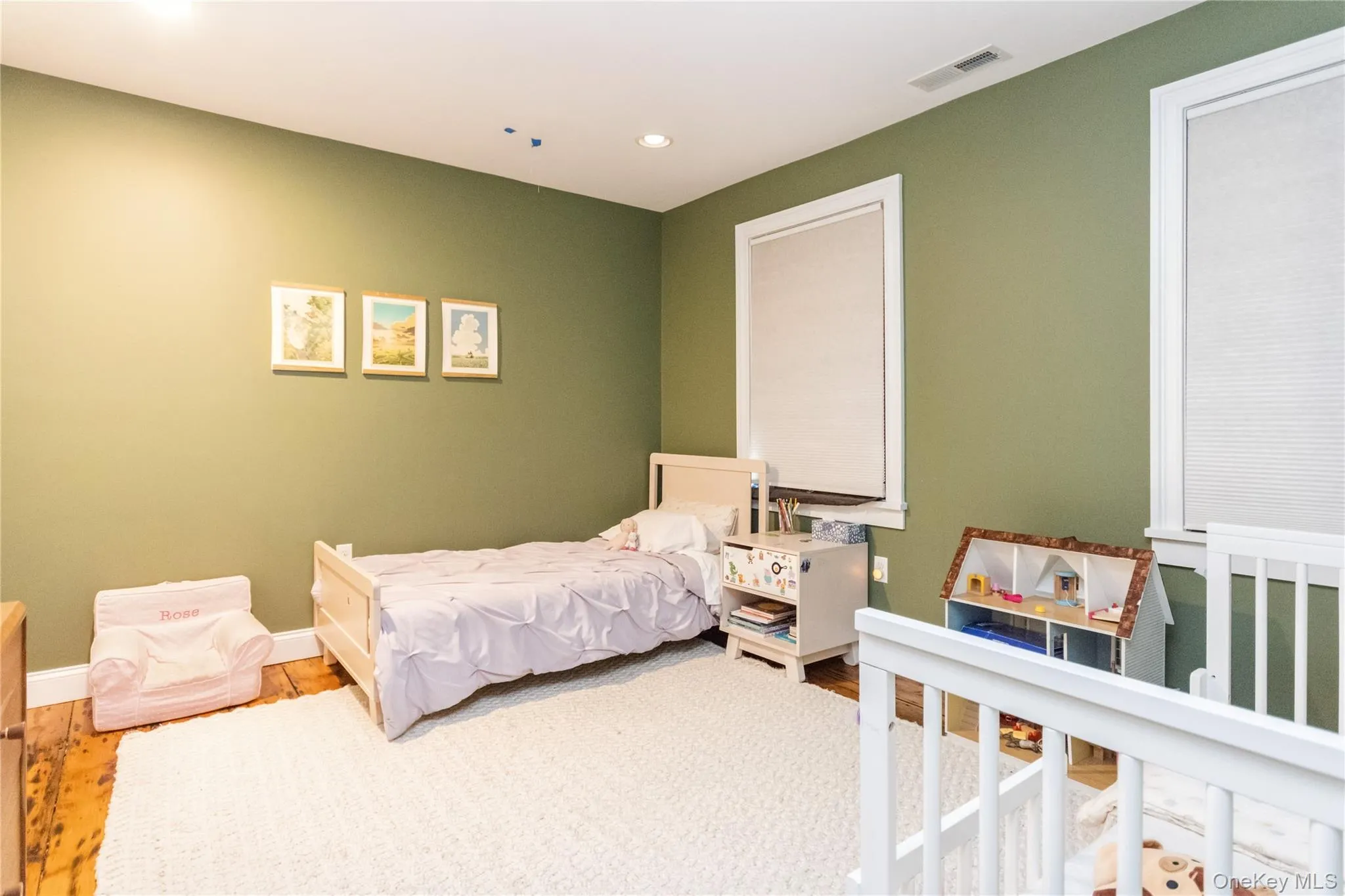 Bedroom featuring wood finished floors and recessed lighting Bedroom featuring wood finished floors and recessed lighting