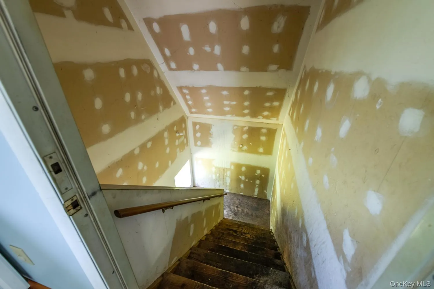 Stairway into finished space above the garage Stairway into finished space above the garage