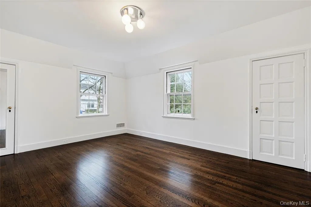 Second floor bedroom and dark wood-style floors Second floor bedroom and dark wood-style floors