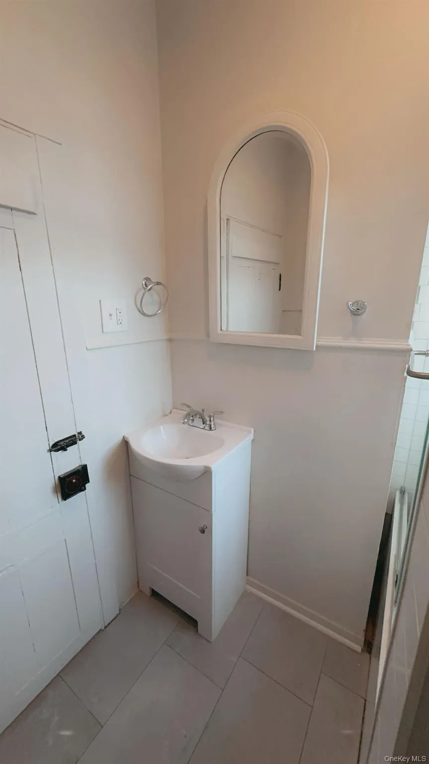Bathroom featuring vanity and tile patterned floors Bathroom featuring vanity and tile patterned floors