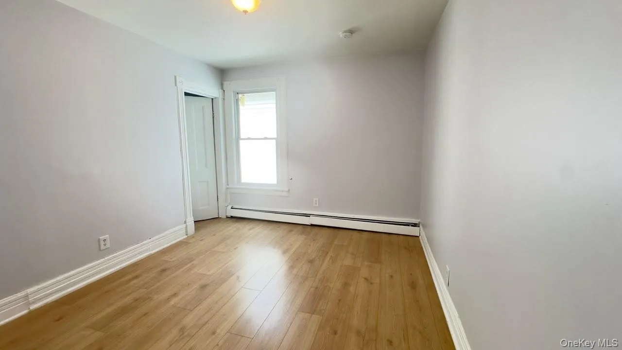 Second bedroom, average size, wood like flooring, baseboard heating Second bedroom, average size, wood like flooring, baseboard heating