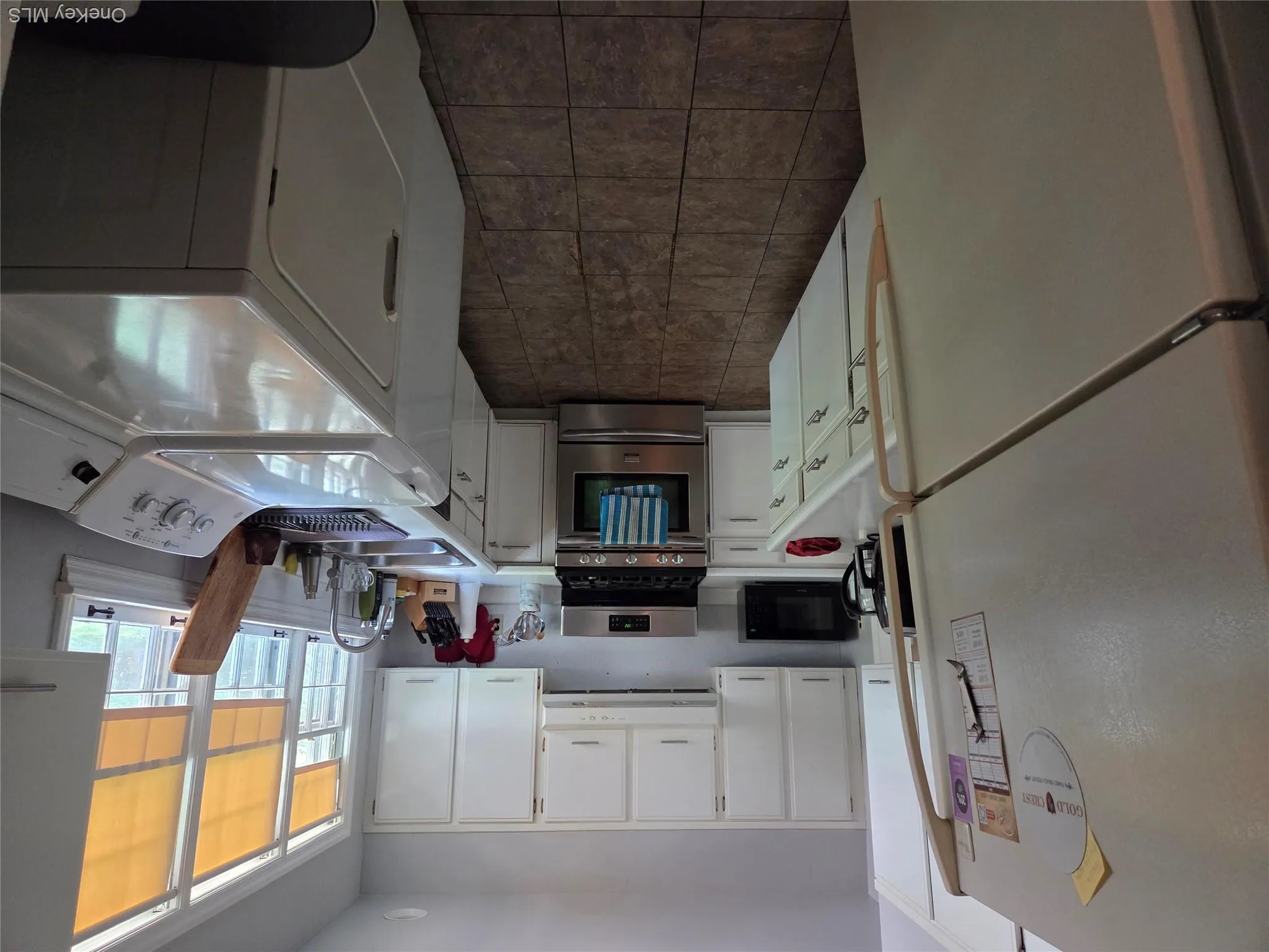 View is from the dining area showing the area showing the washer and dryer set up. View is from the dining area showing the area showing the washer and dryer set up.