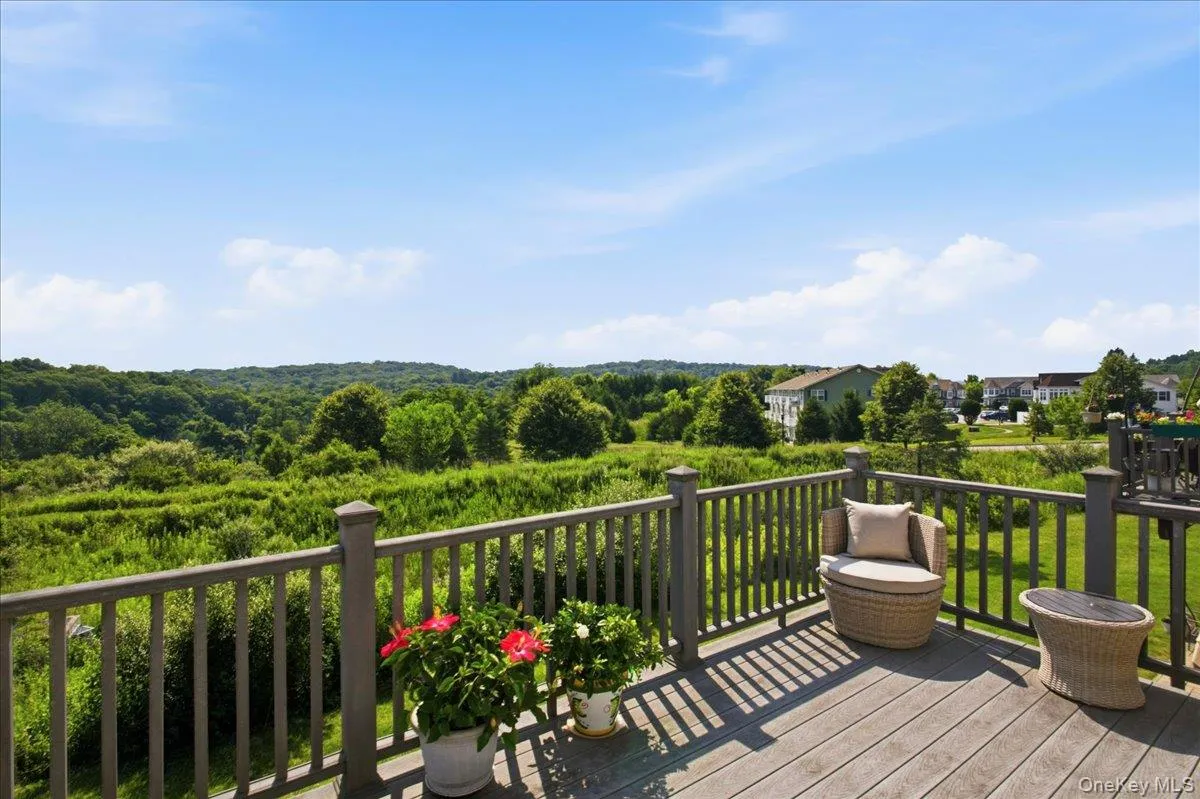 Spacious outdoor deck featuring composite finish decking and a sturdy railing Spacious outdoor deck featuring composite finish decking and a sturdy railing