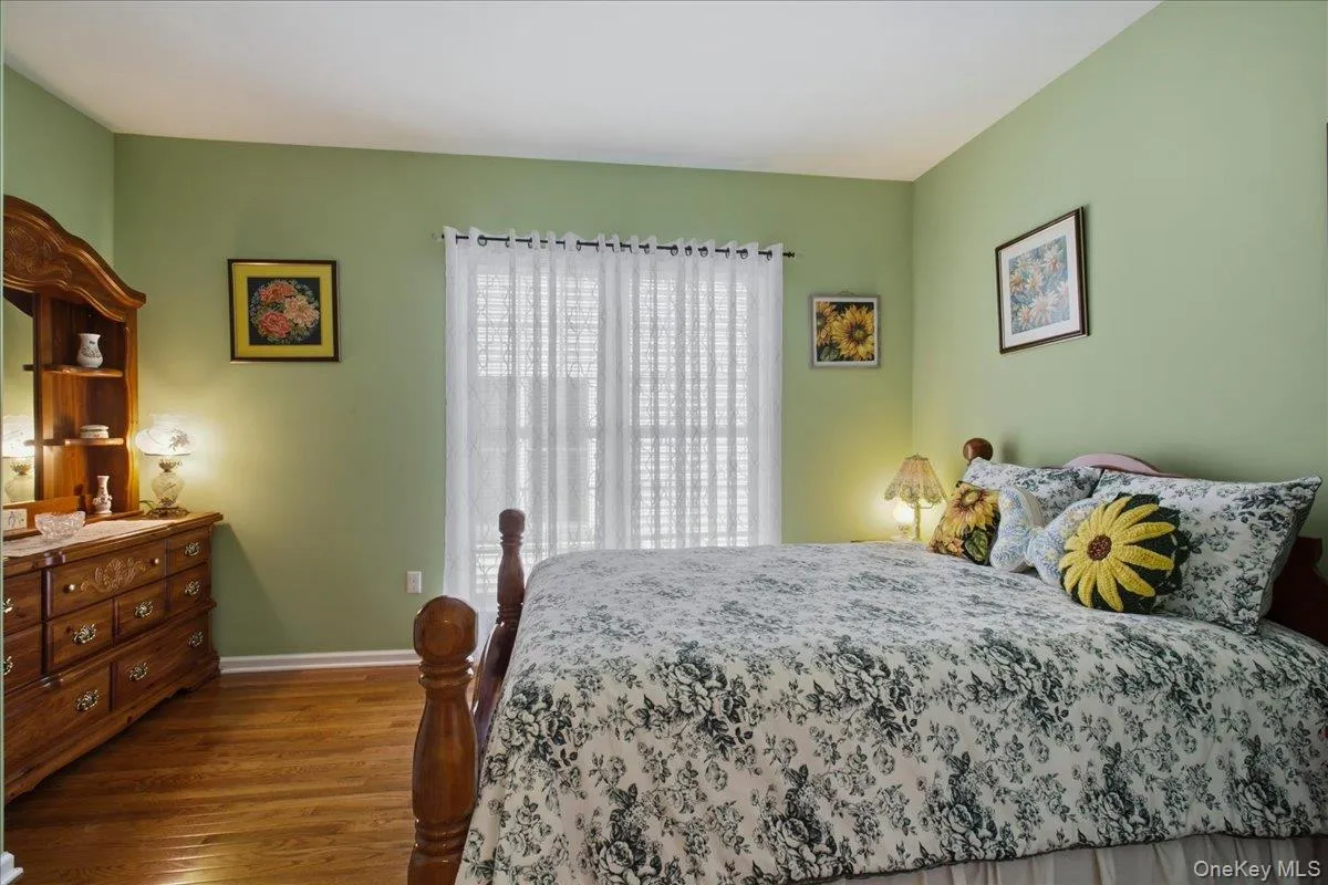 Hardwood flooring, light green painted walls, and white trim molding create a bright interior Hardwood flooring, light green painted walls, and white trim molding create a bright interior