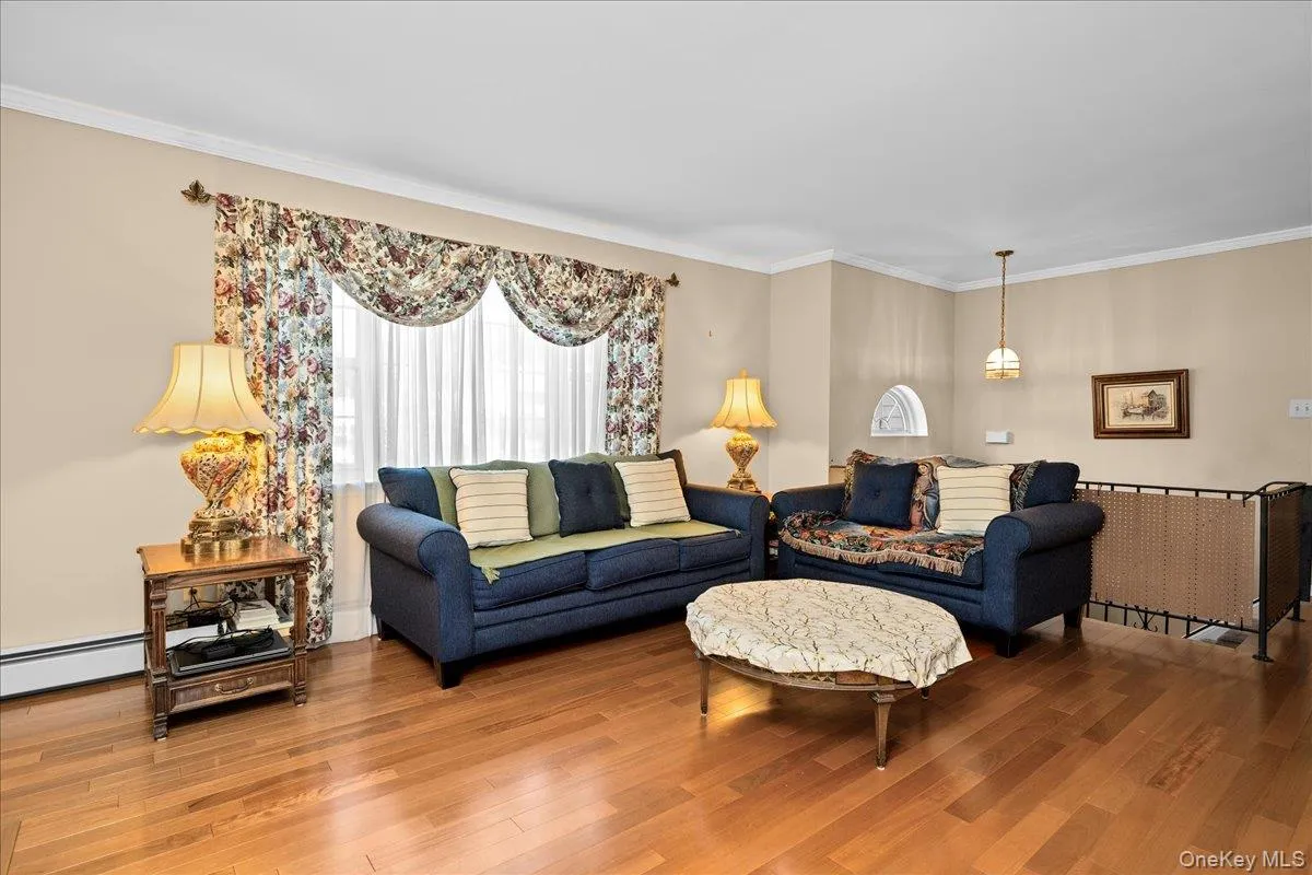Beautiful hardwood flooring complements neutral wall tones and white crown molding Beautiful hardwood flooring complements neutral wall tones and white crown molding