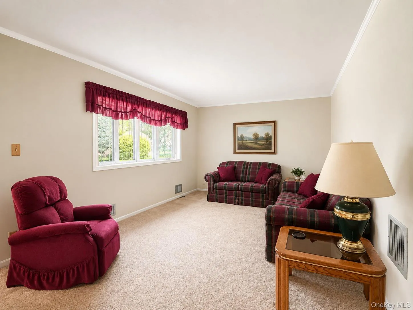 Warmly painted walls complement the neutral carpet flooring Warmly painted walls complement the neutral carpet flooring