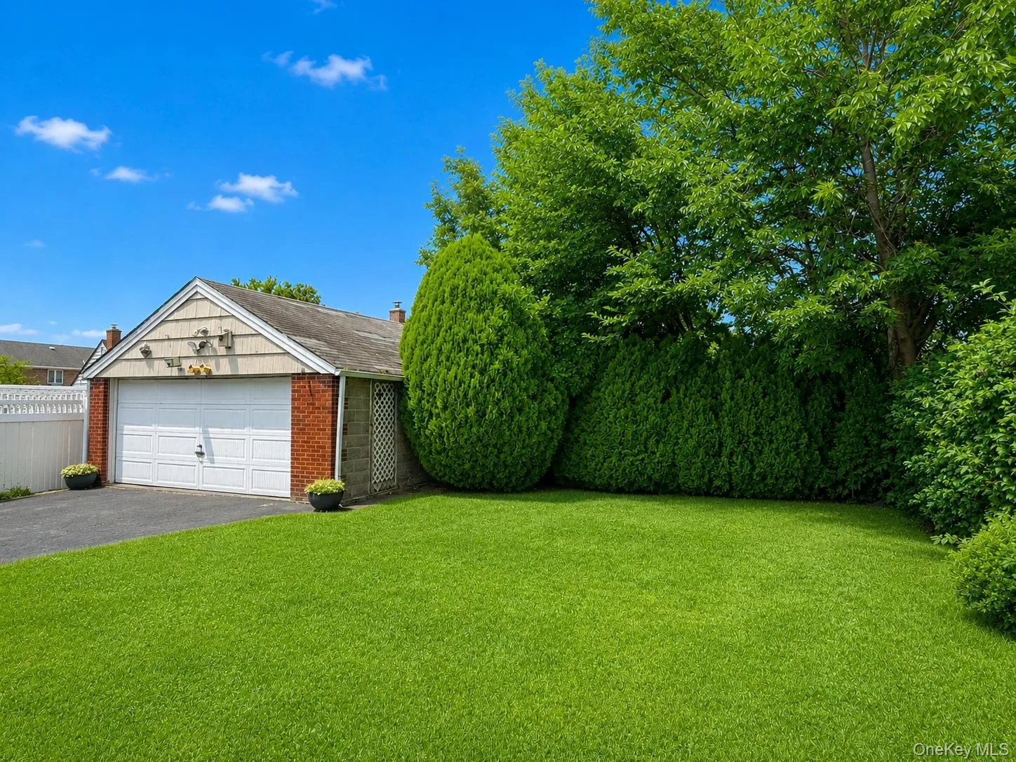 Backyard and two car garage. Backyard and two car garage.