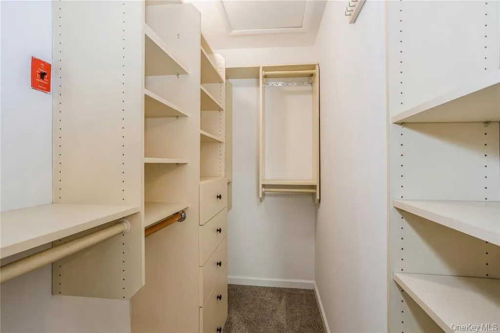 Walk in closet in Primary Bedroom Walk in closet in Primary Bedroom