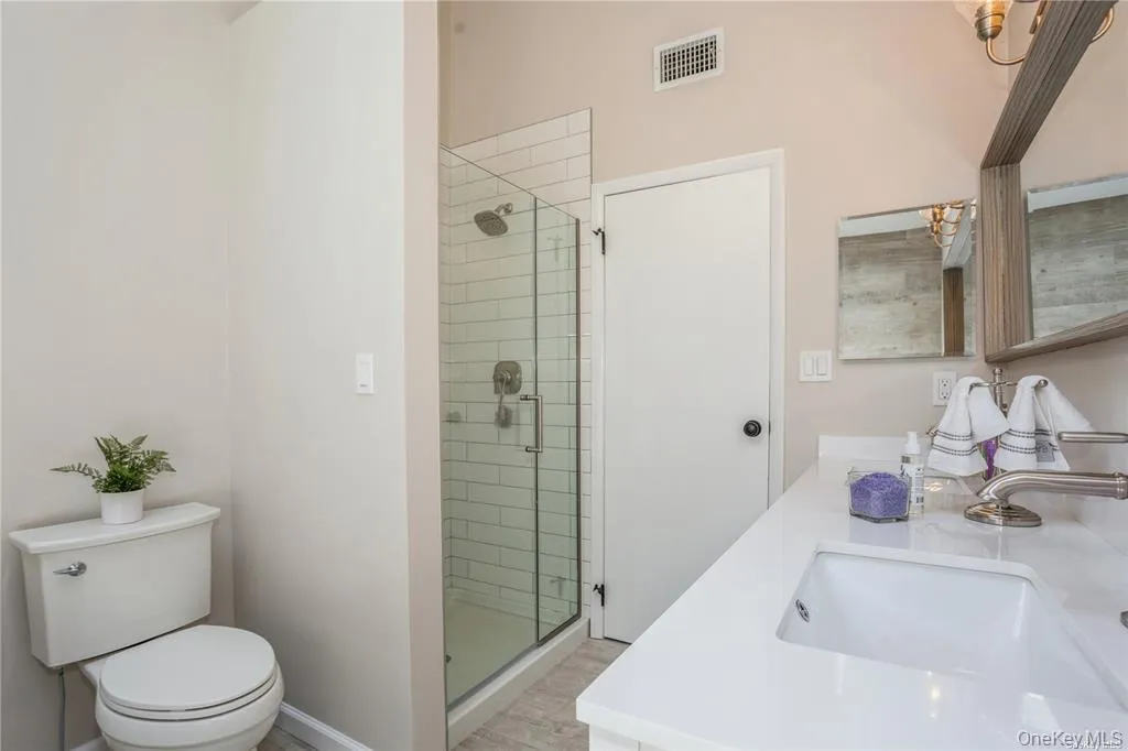 Full primary en suite bathroom with separate shower Full primary en suite bathroom with separate shower