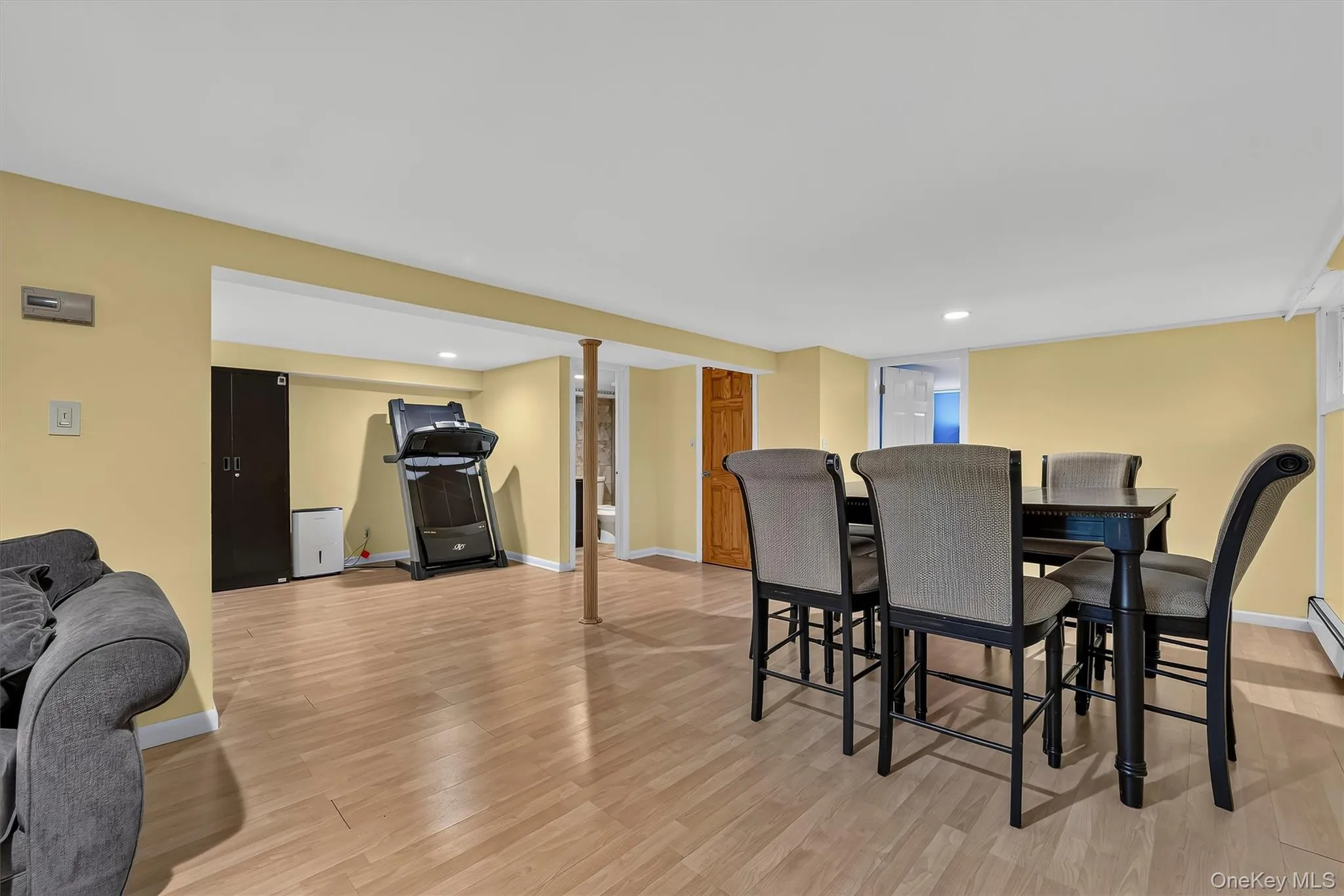 Lower-level living space offers a view into the bonus room and convenient second full bathroom. Lower-level living space offers a view into the bonus room and convenient second full bathroom.