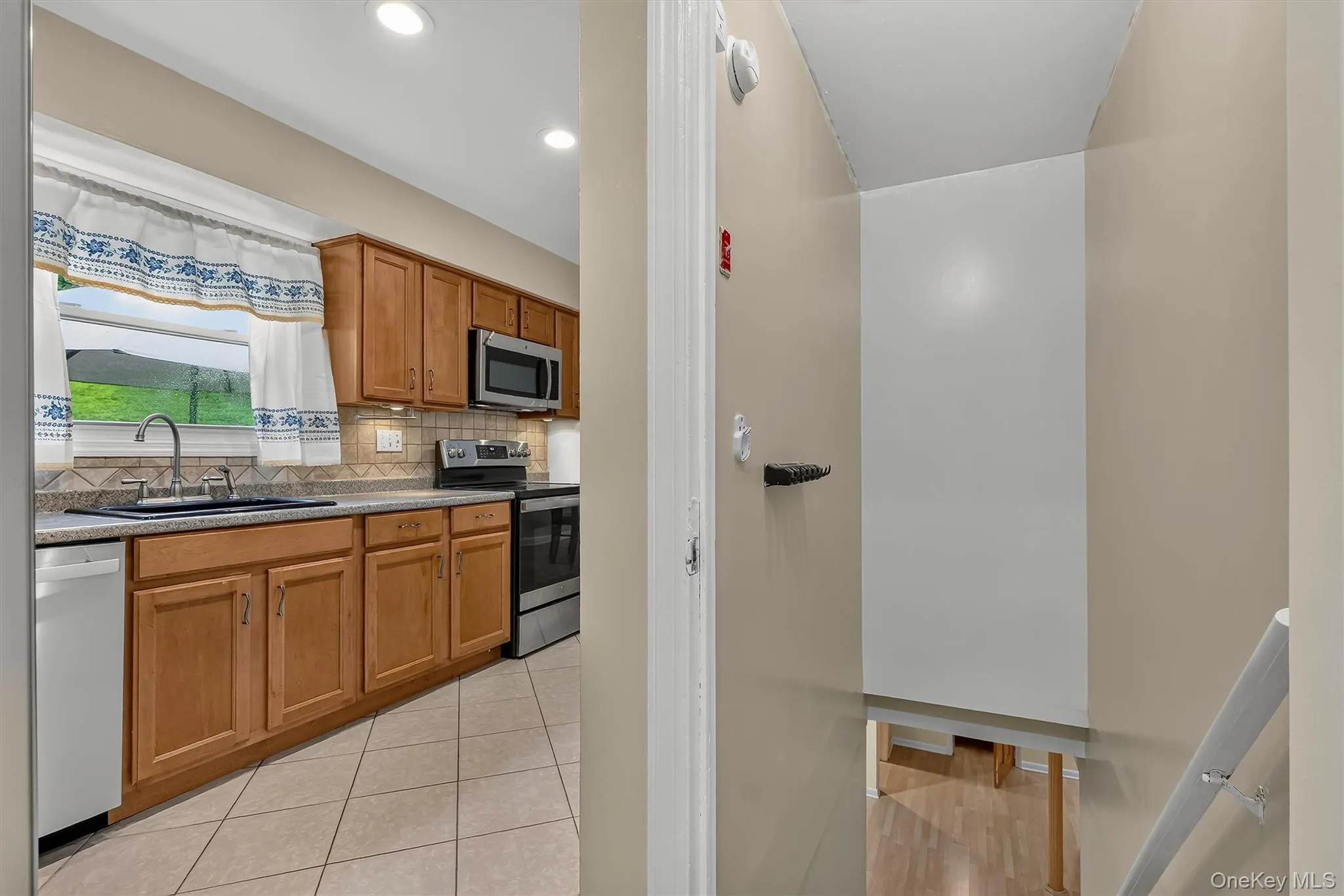 Stairway off the kitchen leads to the spacious lower-level family room and additional living space. Stairway off the kitchen leads to the spacious lower-level family room and additional living space.