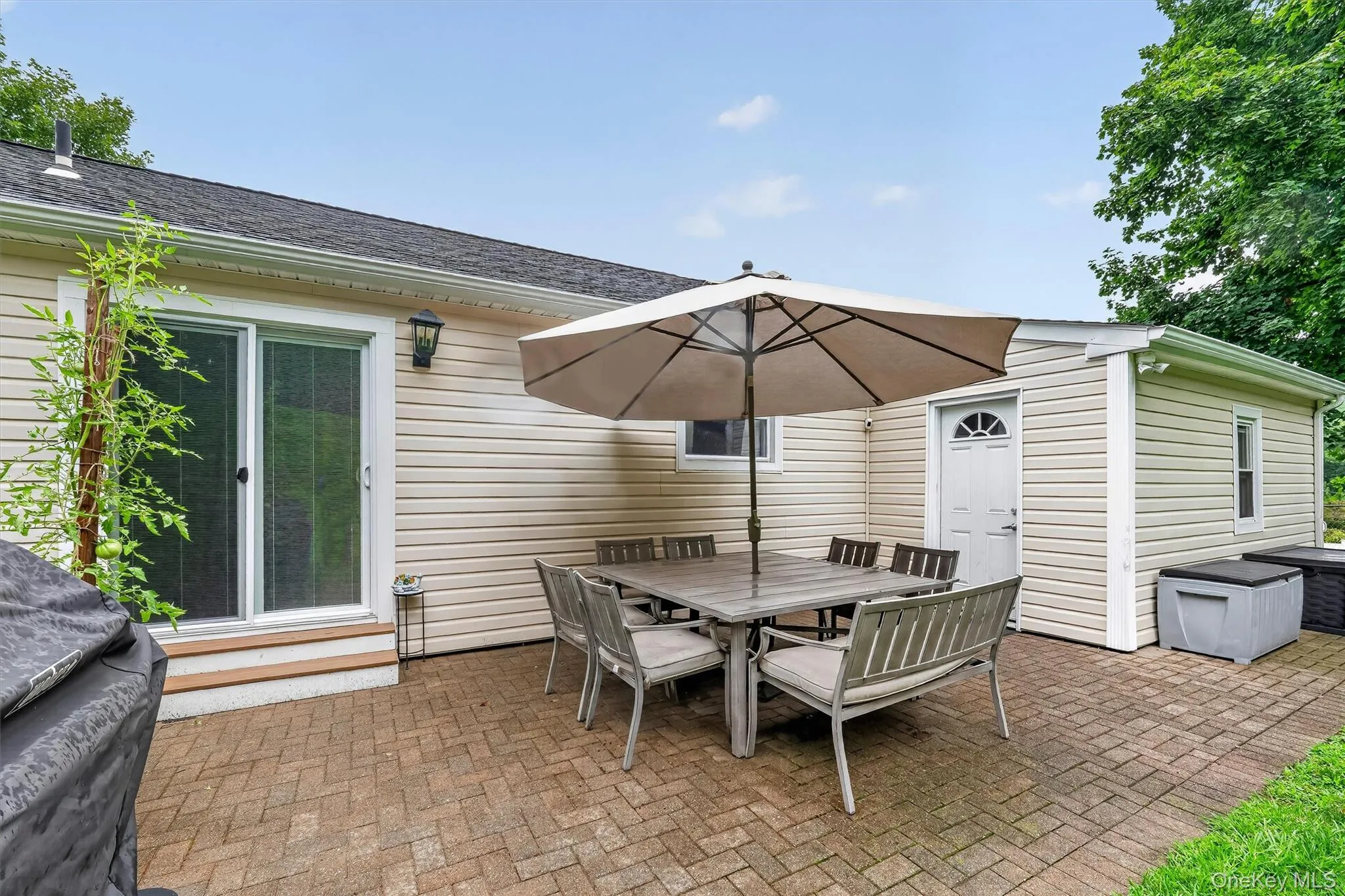 Private backyard with patio, perfect for outdoor dining, relaxing, and entertaining. Private backyard with patio, perfect for outdoor dining, relaxing, and entertaining.