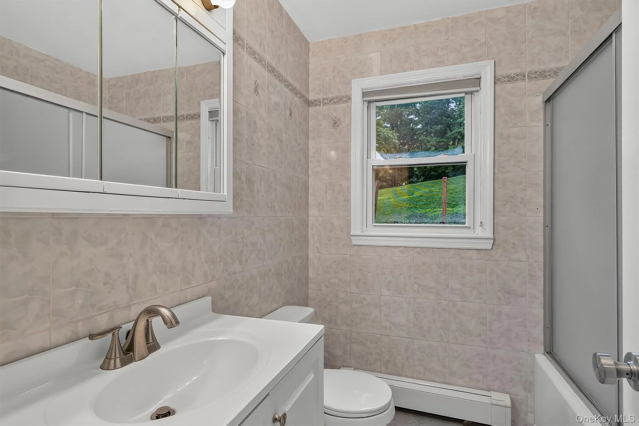Conveniently located main-level full bathroom serves the three bedrooms and main living area. Conveniently located main-level full bathroom serves the three bedrooms and main living area.